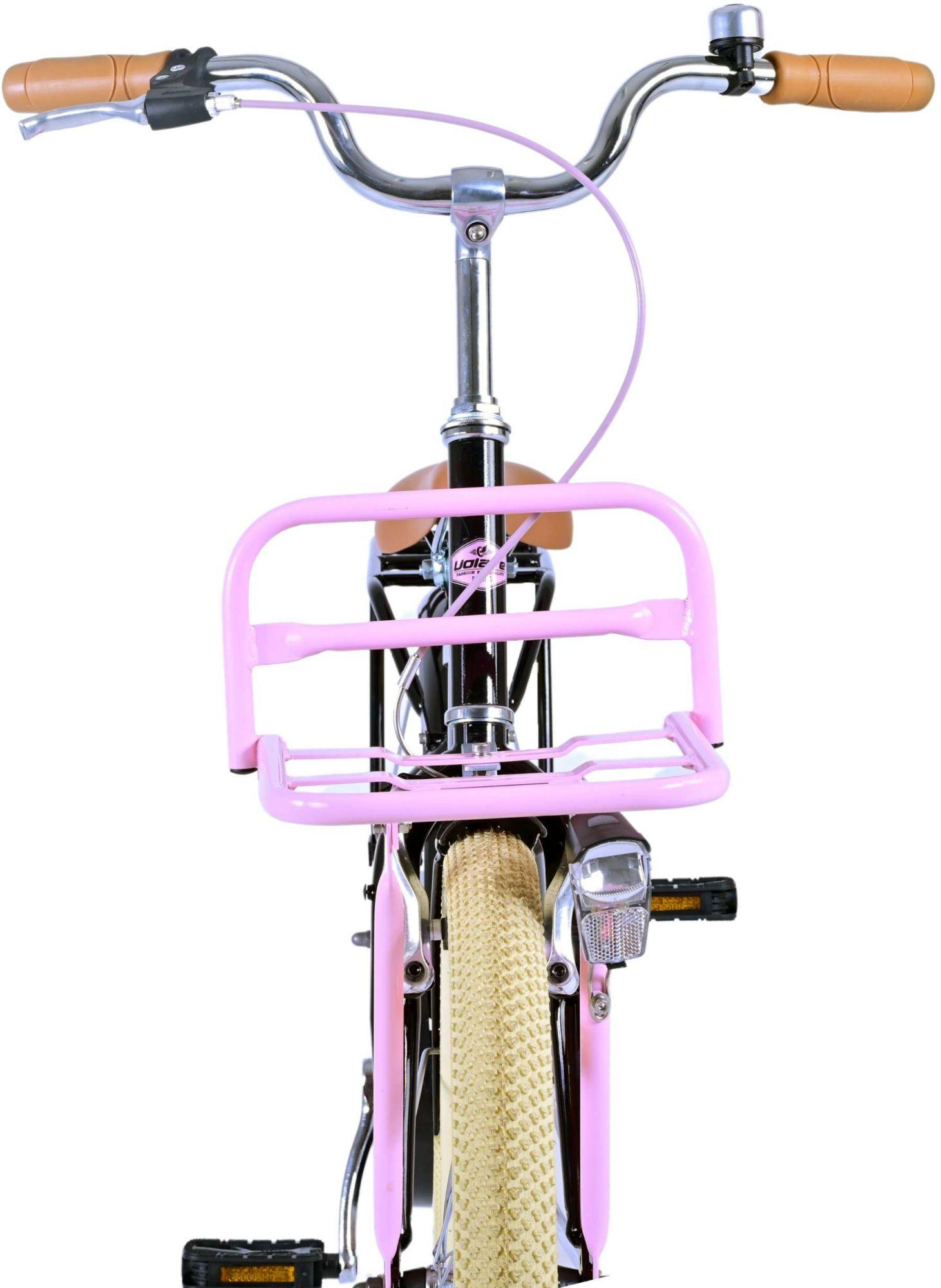 Rosa Fahrrad mit rosa Korb und braunem Sattel, Frontansicht.