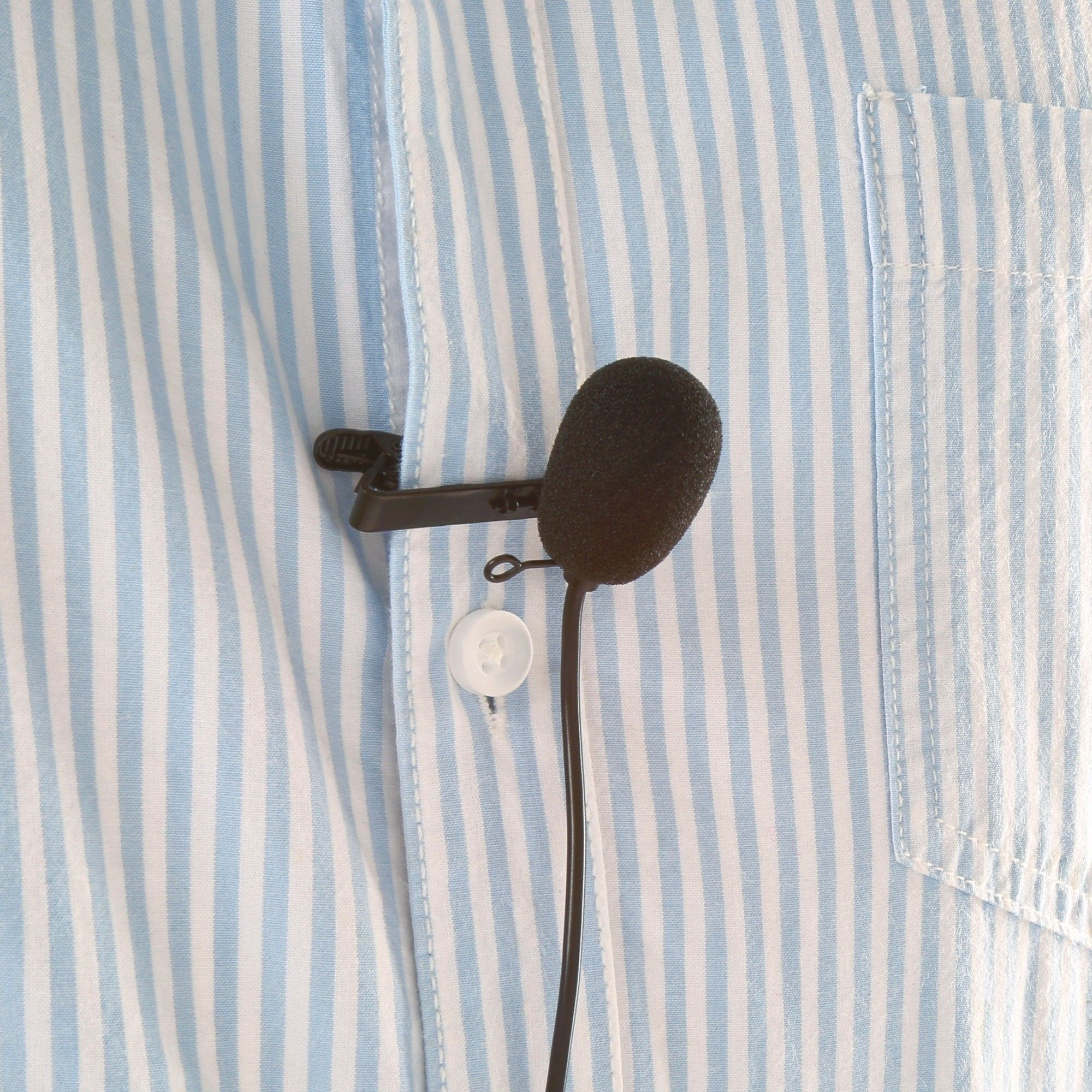 A black microphone clipped to a blue and white striped shirt.