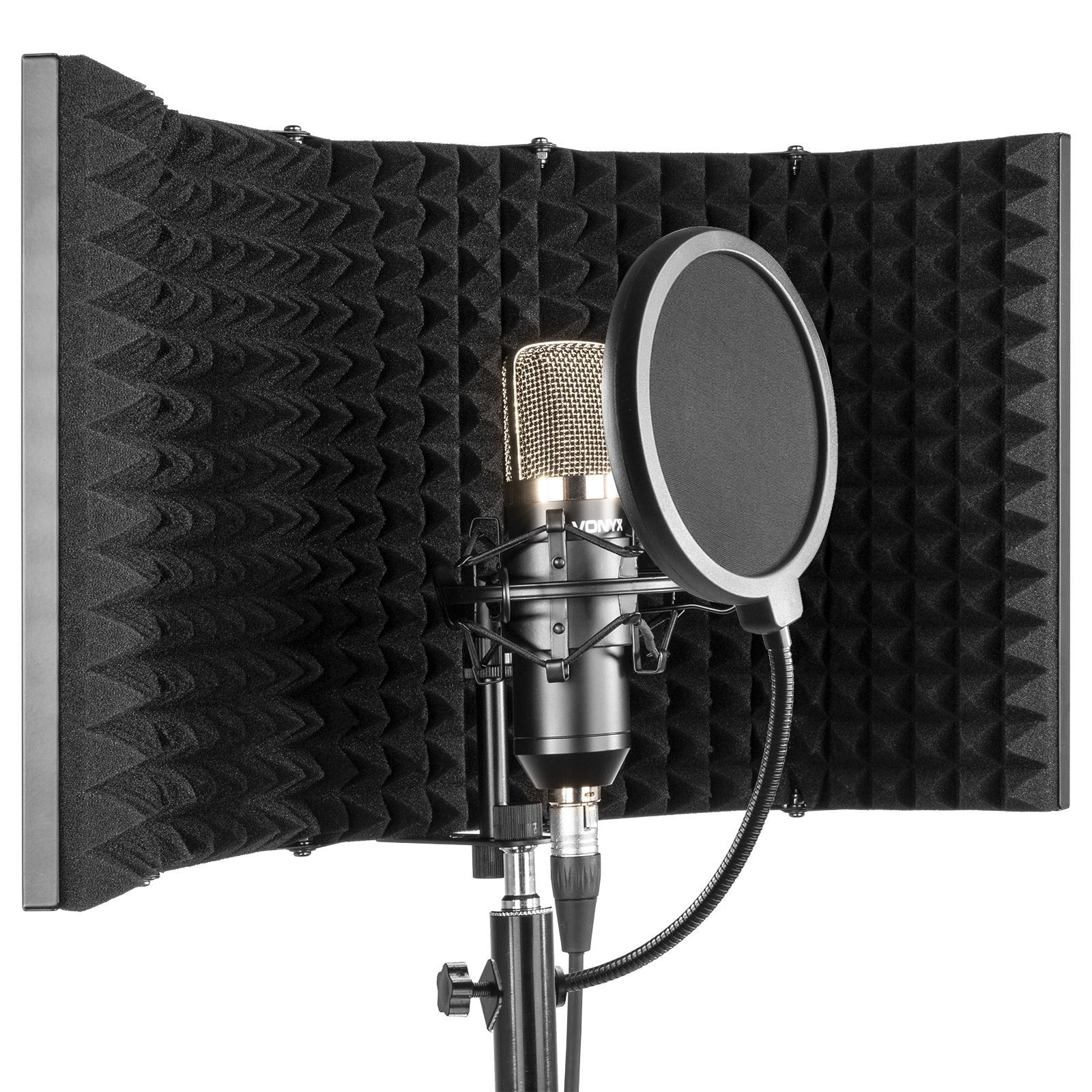 A gold microphone is positioned in front of a foam panel and a pop filter, on a stand.