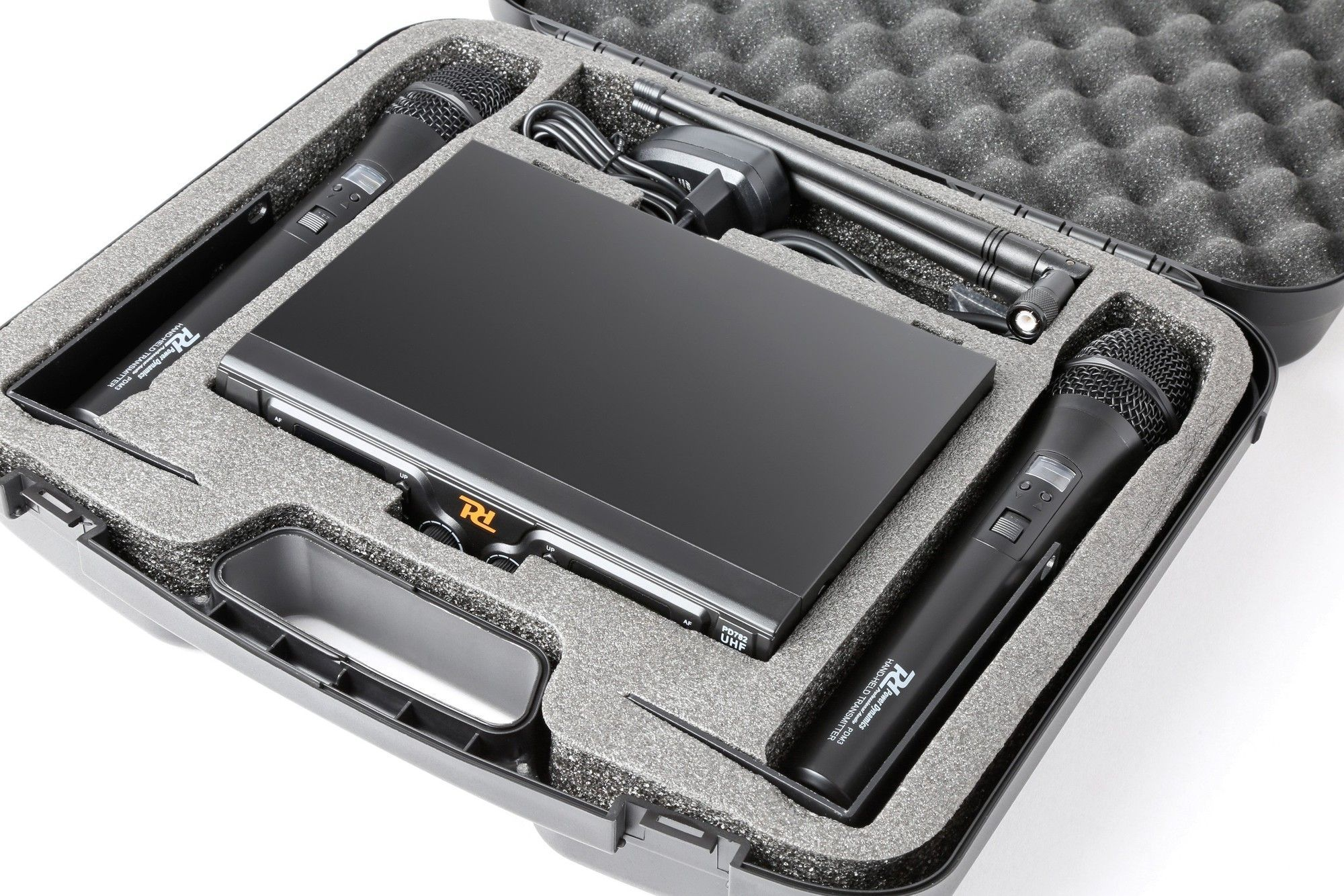 Black carrying case, open, with microphone equipment inside. Gray foam. White background.