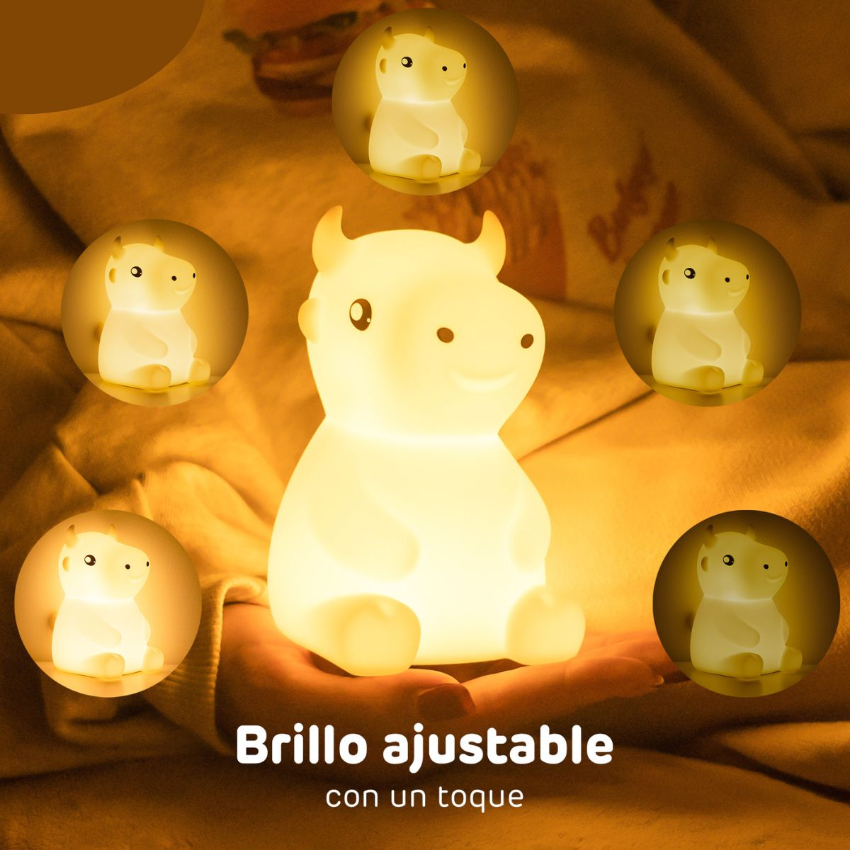 Luz de noche blanca en forma de vaca, rodeada de luces más pequeñas, con texto abajo.