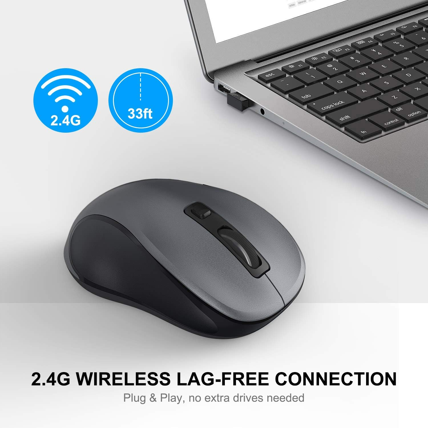 Un ratón inalámbrico gris junto a un portátil. Tiene 2,4G inalámbrico y un alcance de 33 pies.