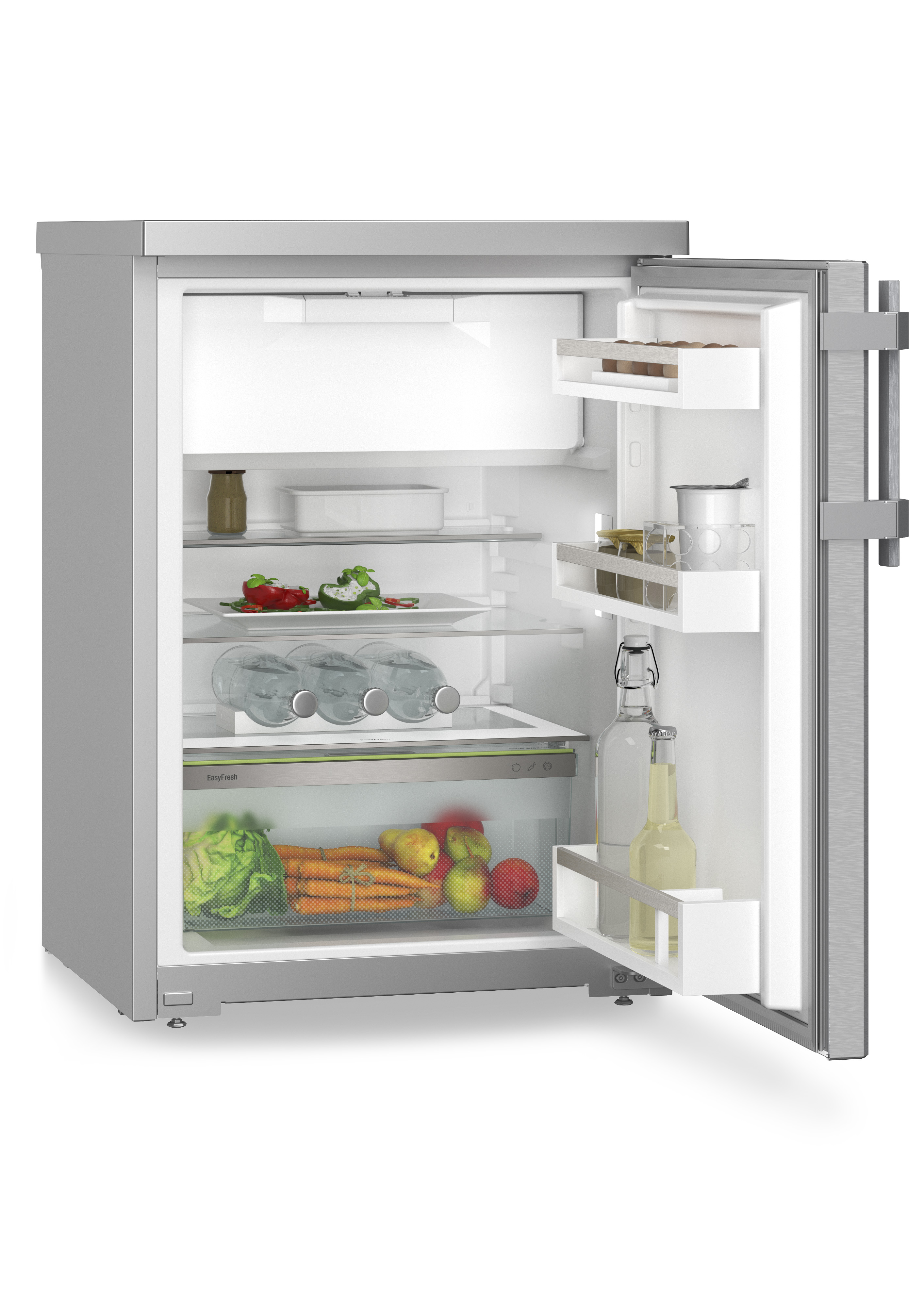 Refrigerador abierto con comida visible. Vegetales, botellas y frutas.