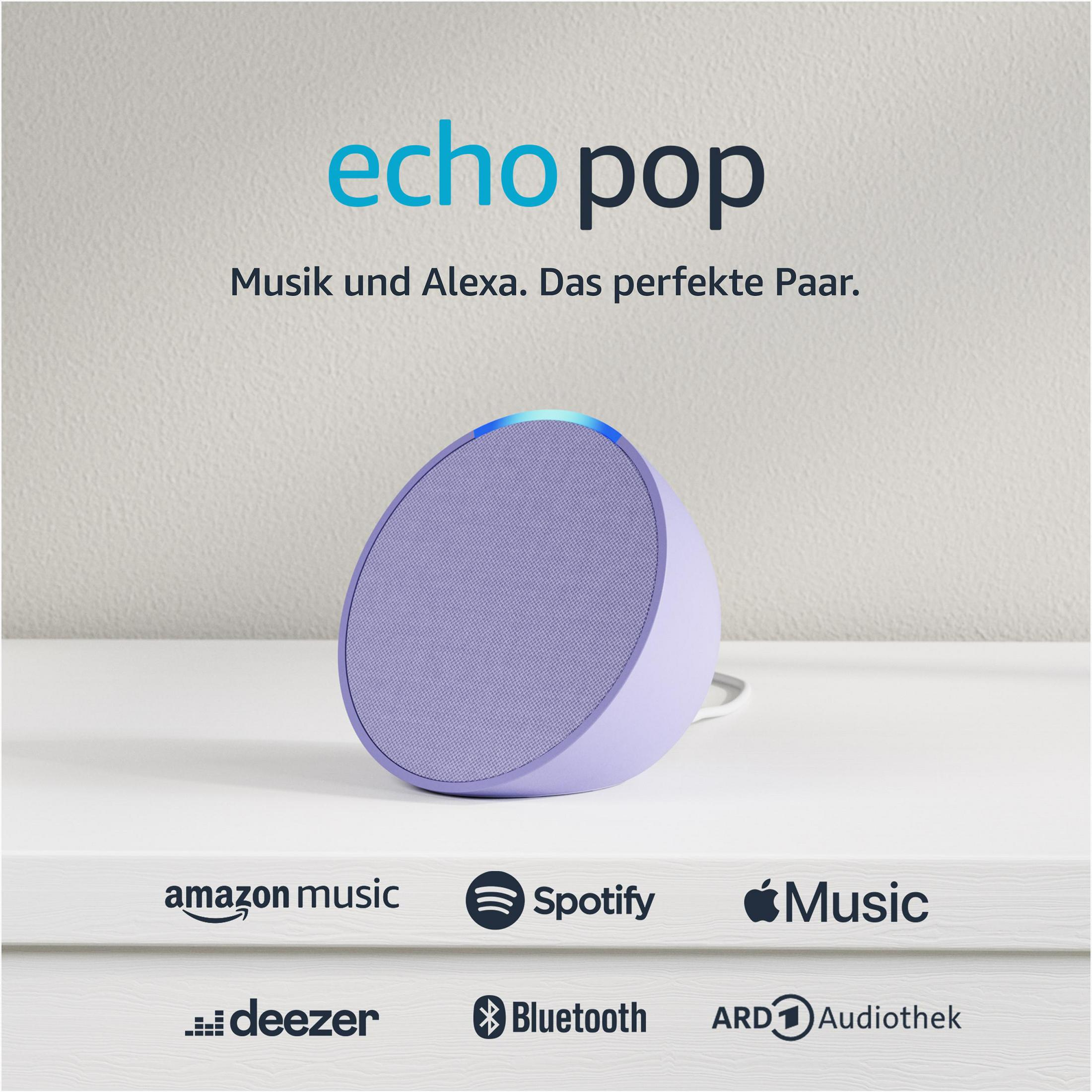Altavoz Echo Pop morado sobre una superficie blanca, con logotipos de servicios de música debajo.
