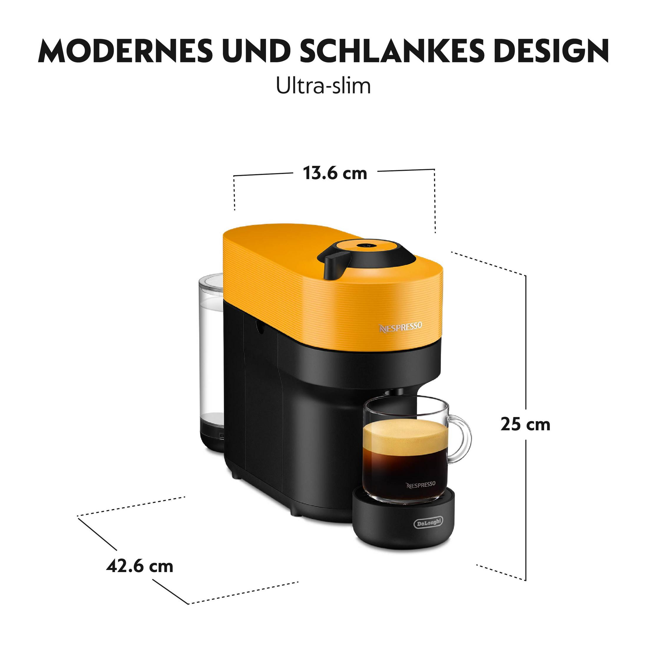 Eine gelb-schwarze Nespresso-Maschine mit Abmessungen, mit einem Glas Kaffee.