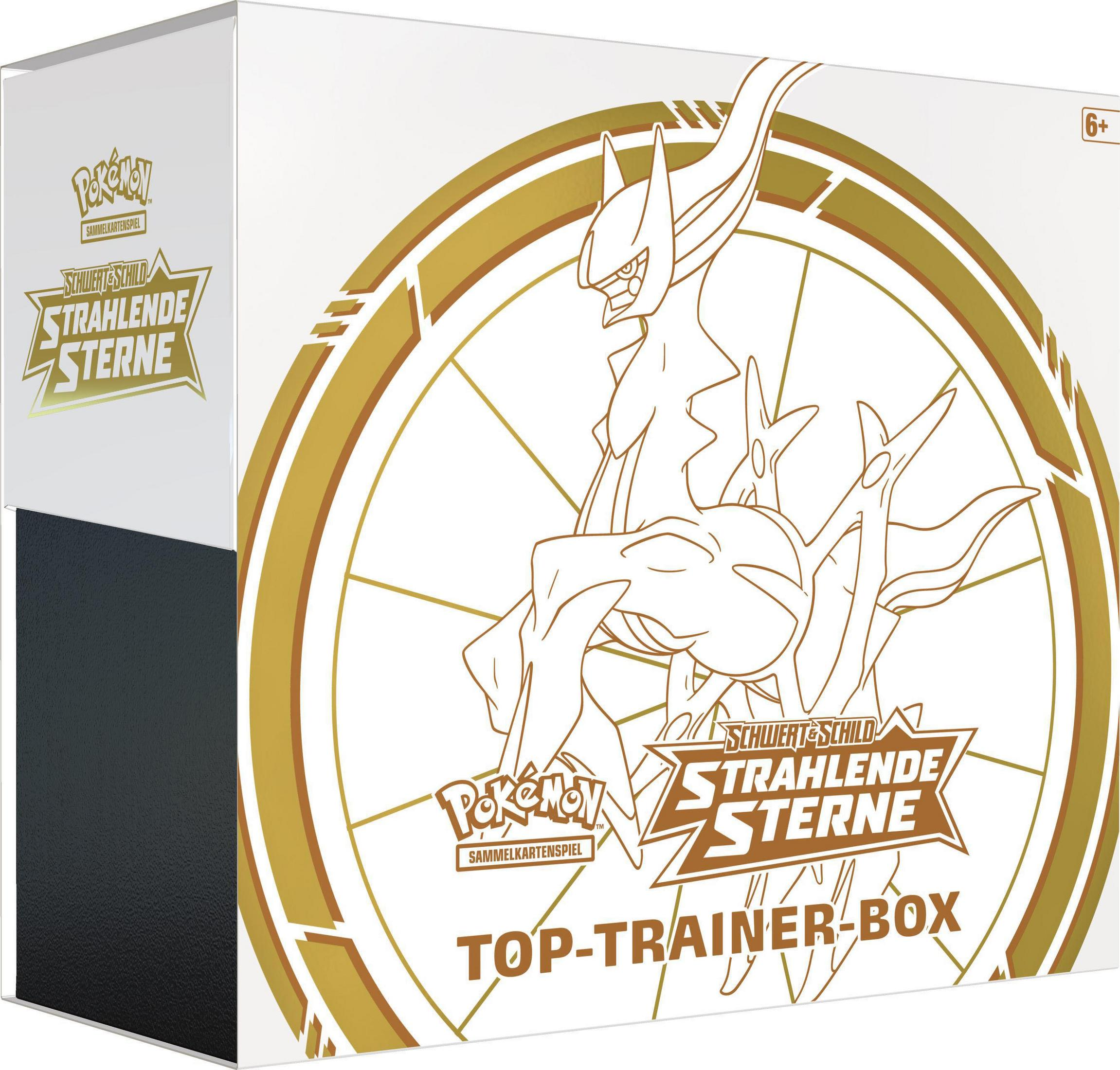 Pokemon Top Trainer Box. Weiße Box mit goldenen Akzenten und Bildern.