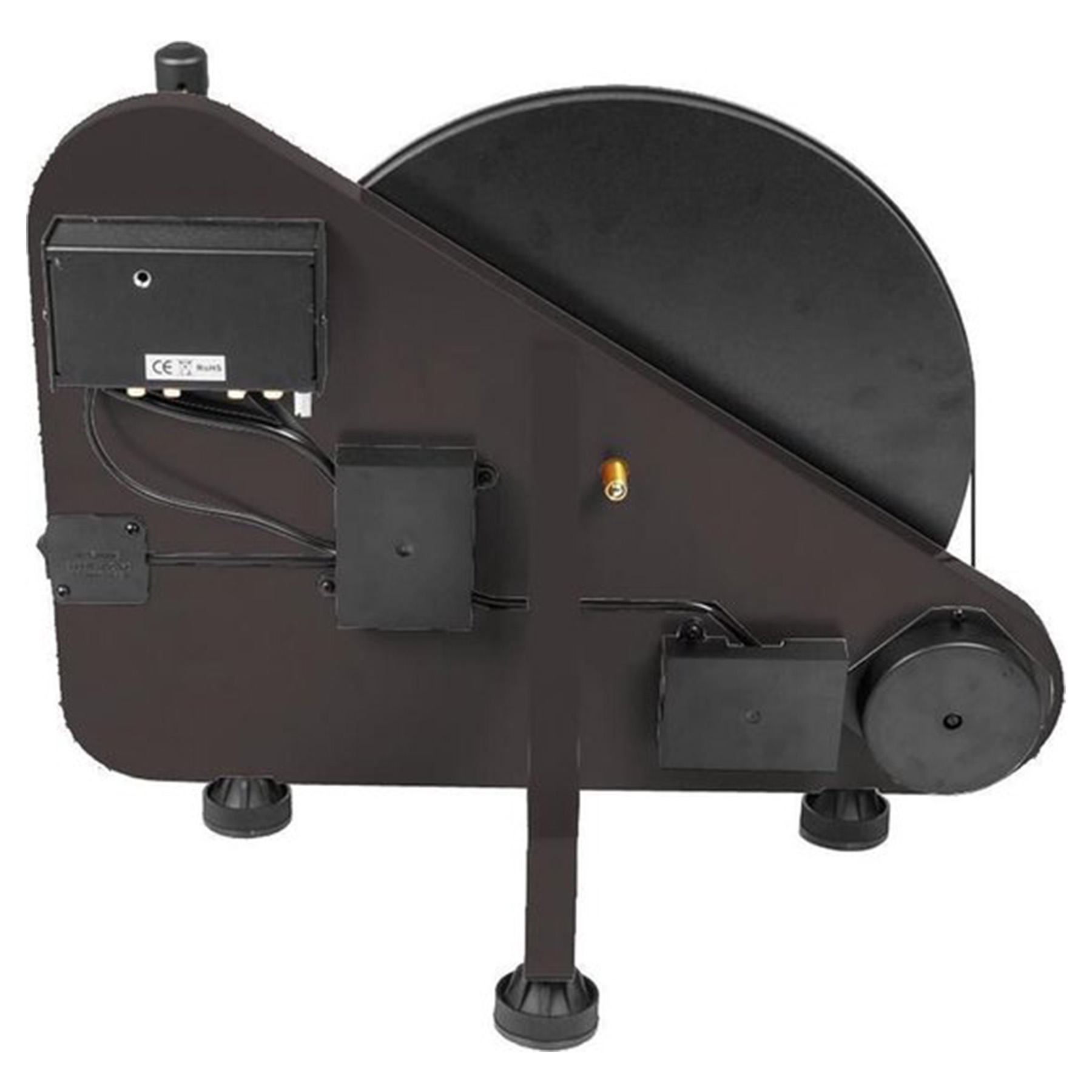 Una macchina marrone scuro con un grande disco nero. Ha diverse scatole e una base con quattro gambe.
