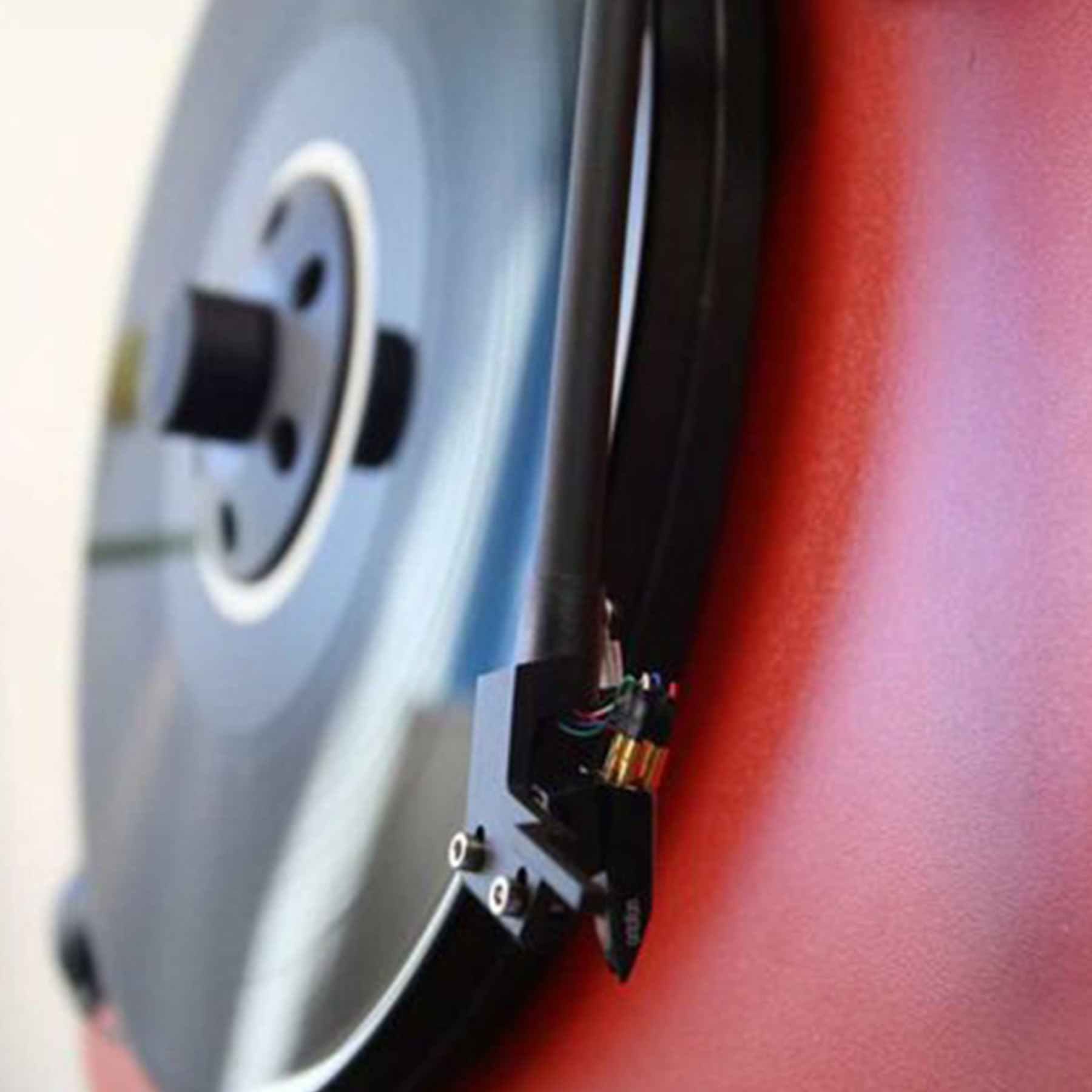 Close-up of a record player with a spinning black vinyl record.