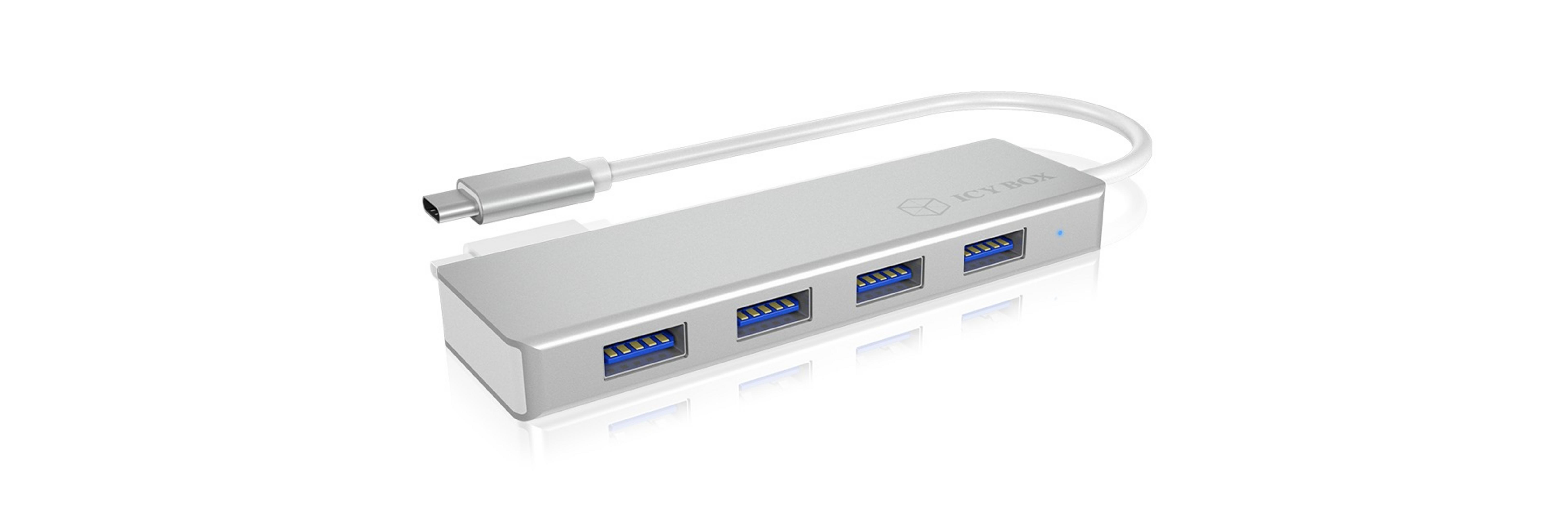 Silberner USB-Hub mit vier Anschlüssen und einem USB-C-Anschluss.