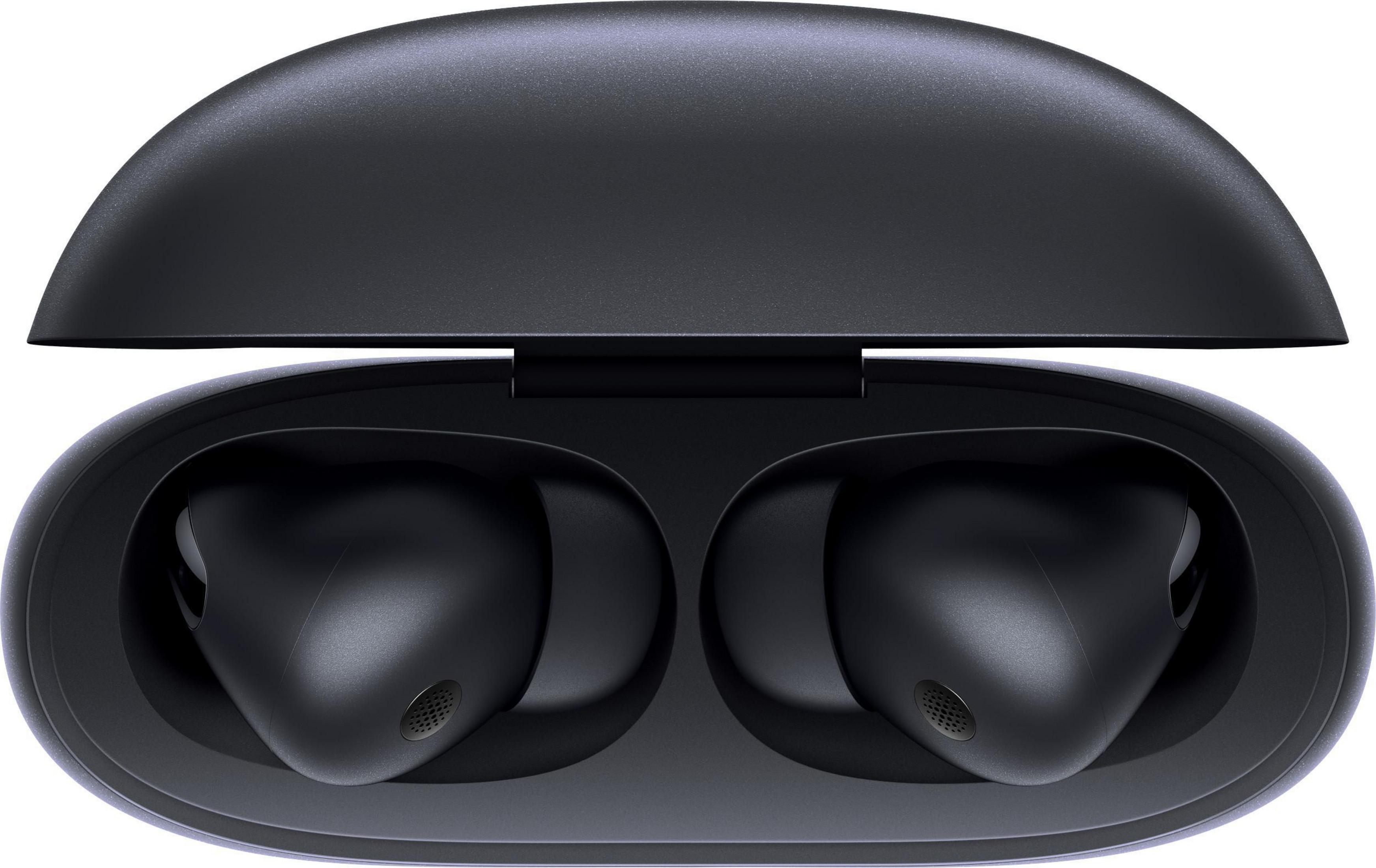 Auriculares inalámbricos negros en un estuche de carga negro, abierto. Fondo blanco.
