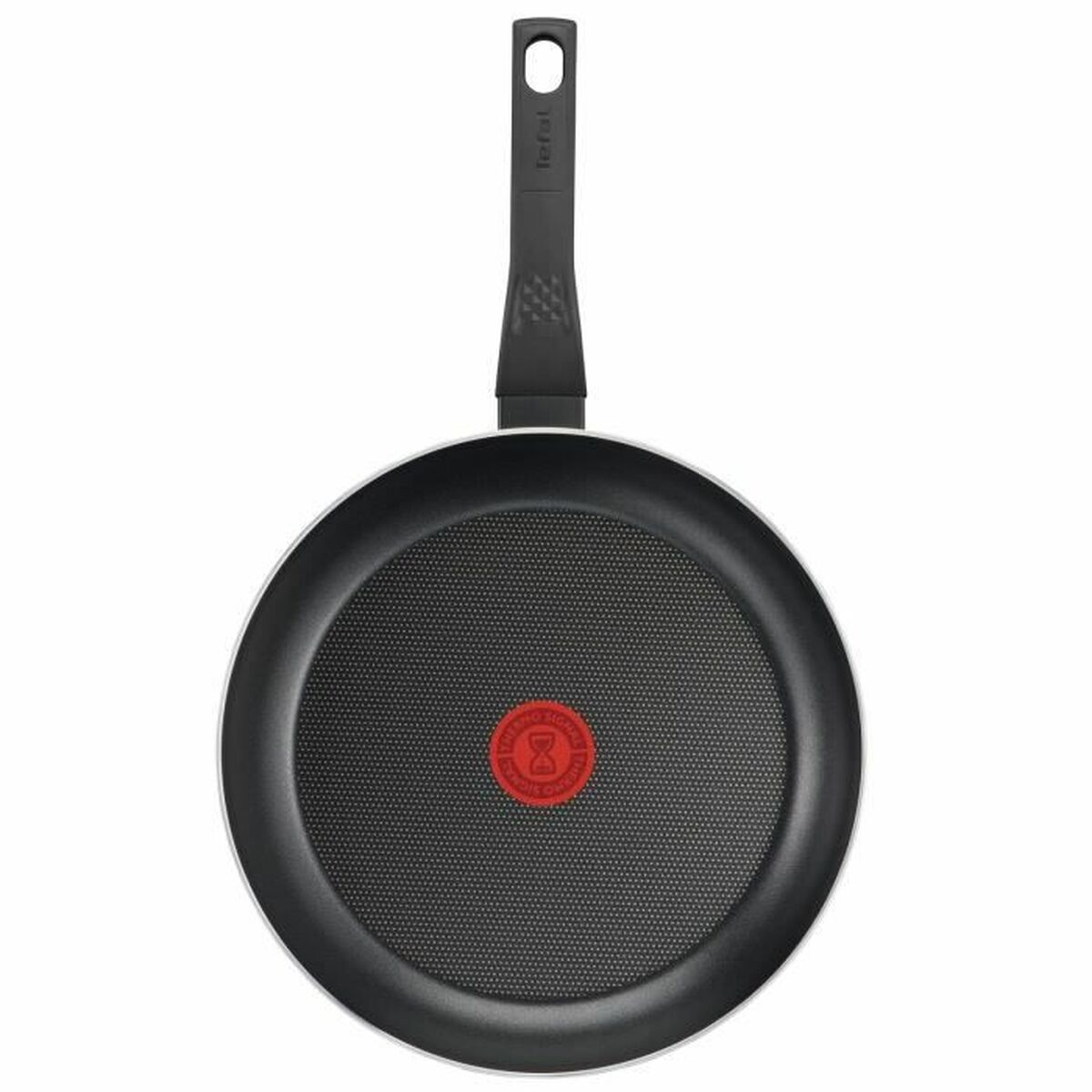 Eine schwarze Bratpfanne mit einem roten Punkt in der Mitte, weißer Hintergrund.