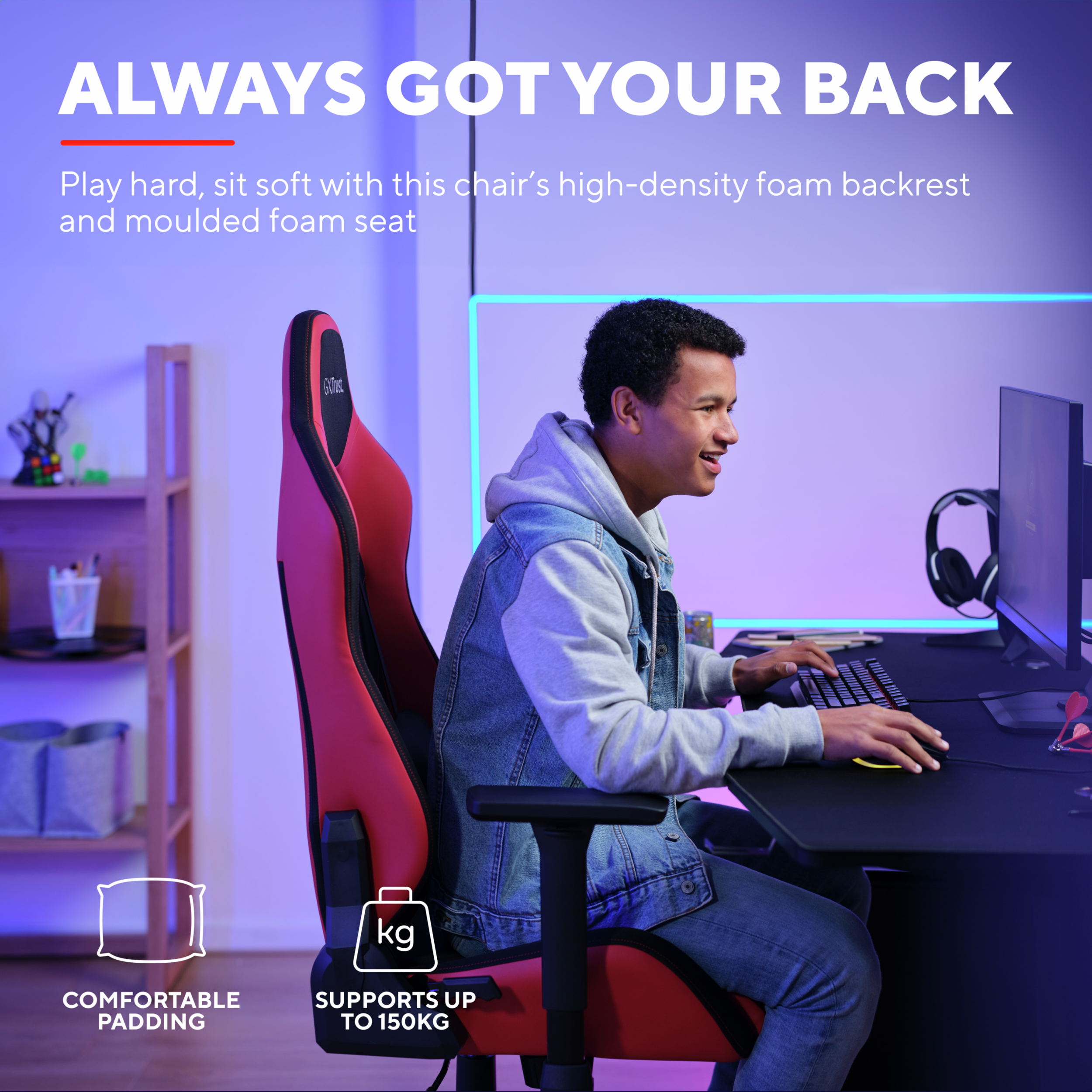 Ein Gamer sitzt in einem roten Stuhl und tippt auf einer Tastatur. Text sagt 'ALWAYS GOT YOUR BACK'.