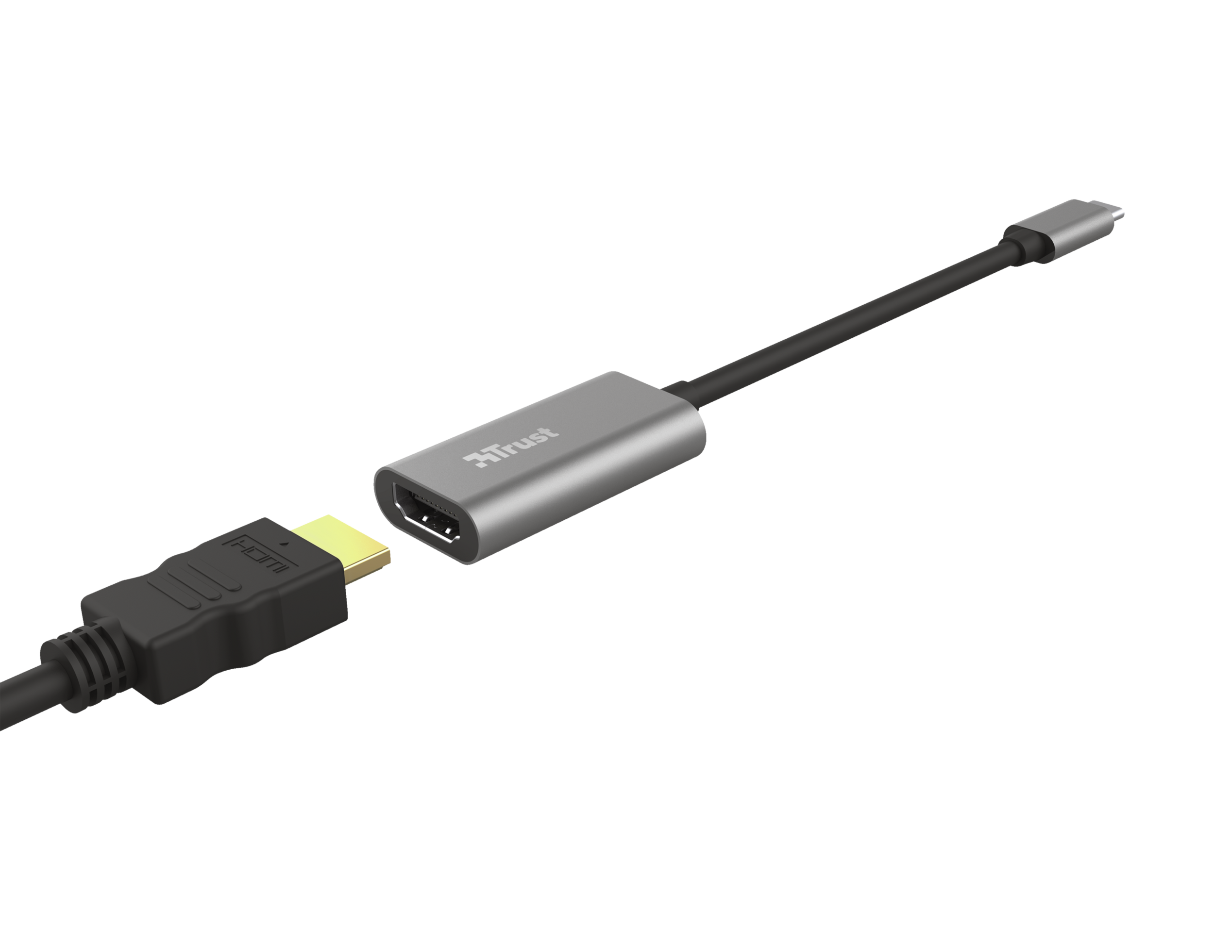 HDMI-kabel aangesloten op een adapter. Adapter zegt Trust. Zwarte achtergrond. Zilveren adapter.