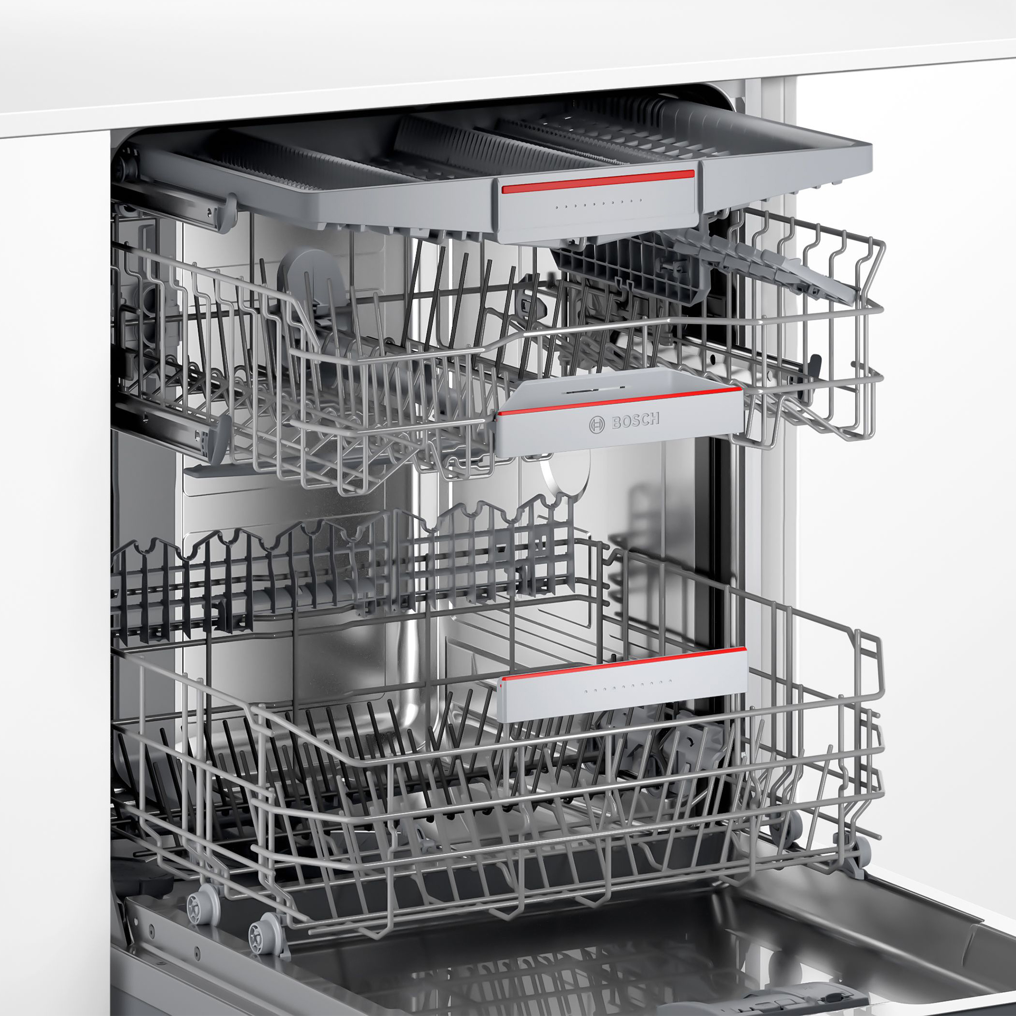Interno della lavastoviglie con due cestelli. Cestelli argentati con accenti rossi, visibili all'interno di un elettrodomestico bianco.