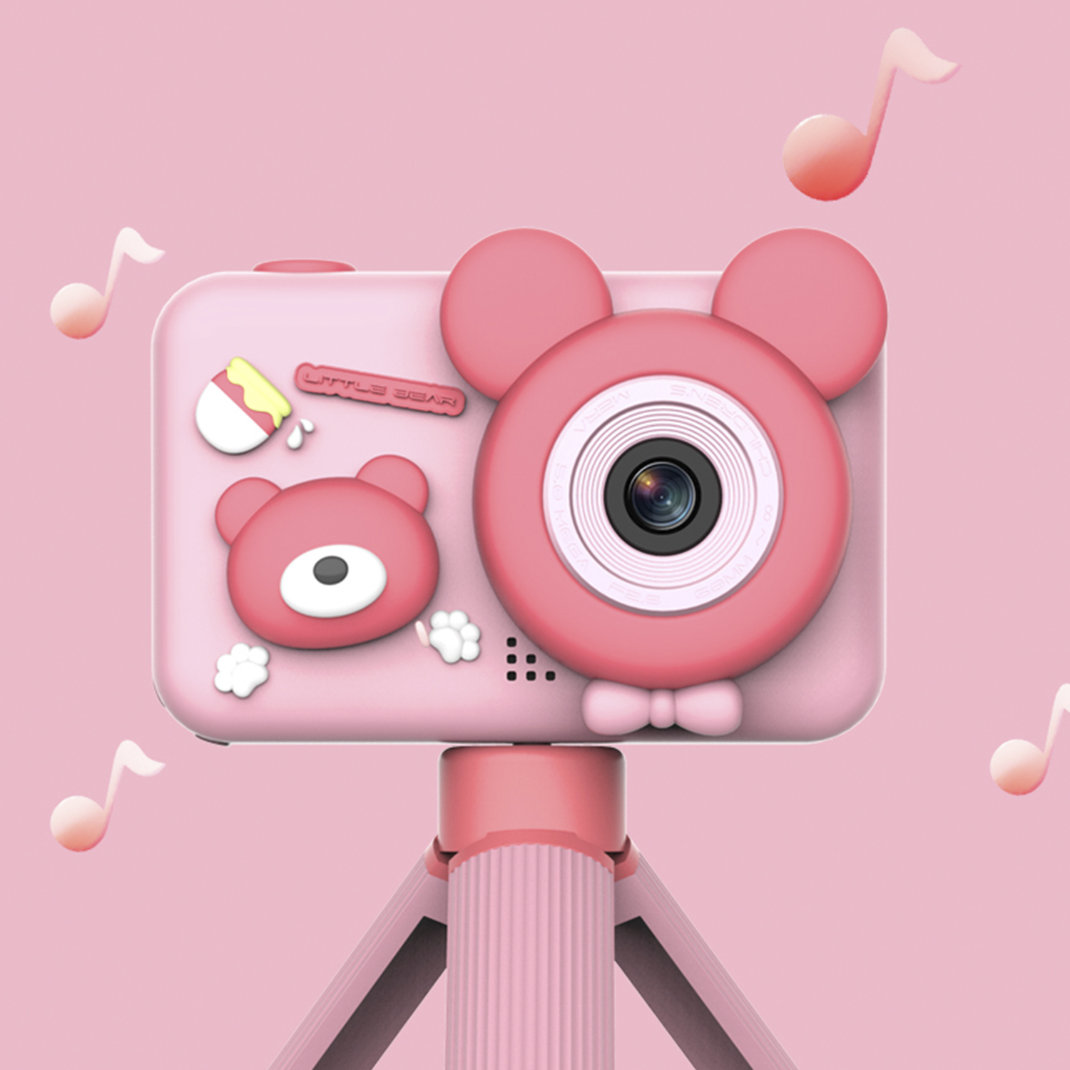 Cámara de juguete rosa con diseño de oso, montada en un trípode rosa pequeño.