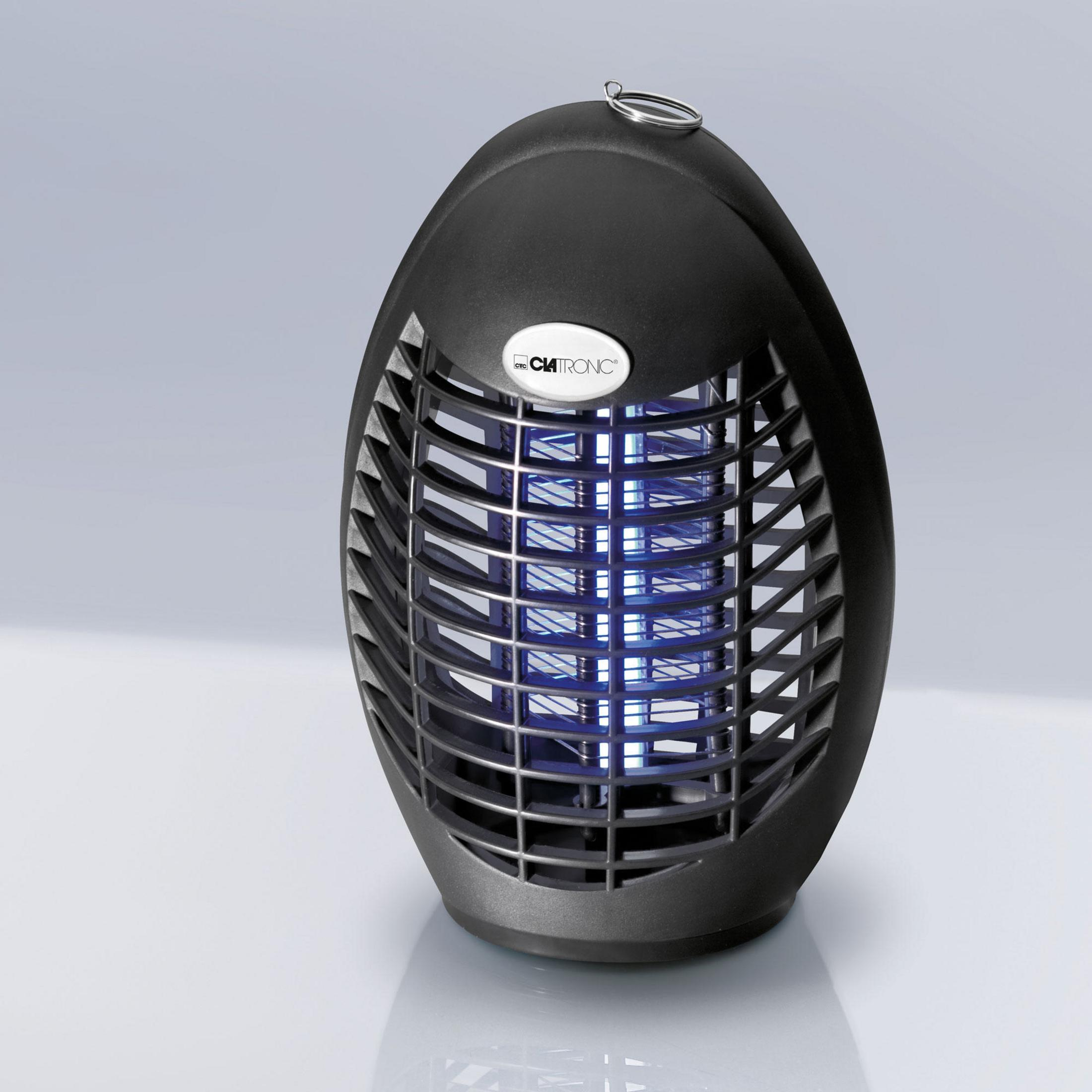 Mata insectos negro con luz azul. El matainsectos tiene un diseño de rejilla.