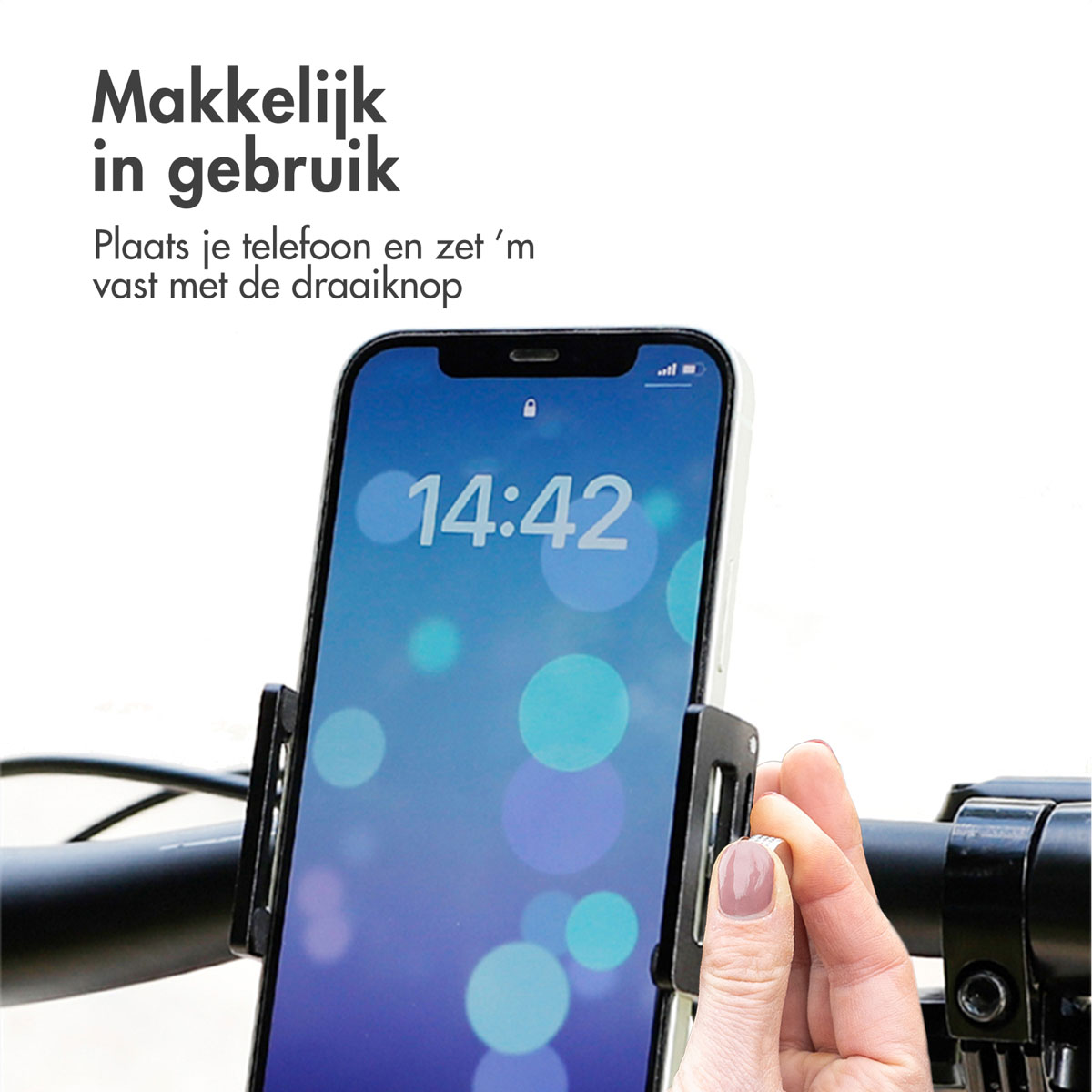 A smartphone is placed in a holder attached to a handlebar.