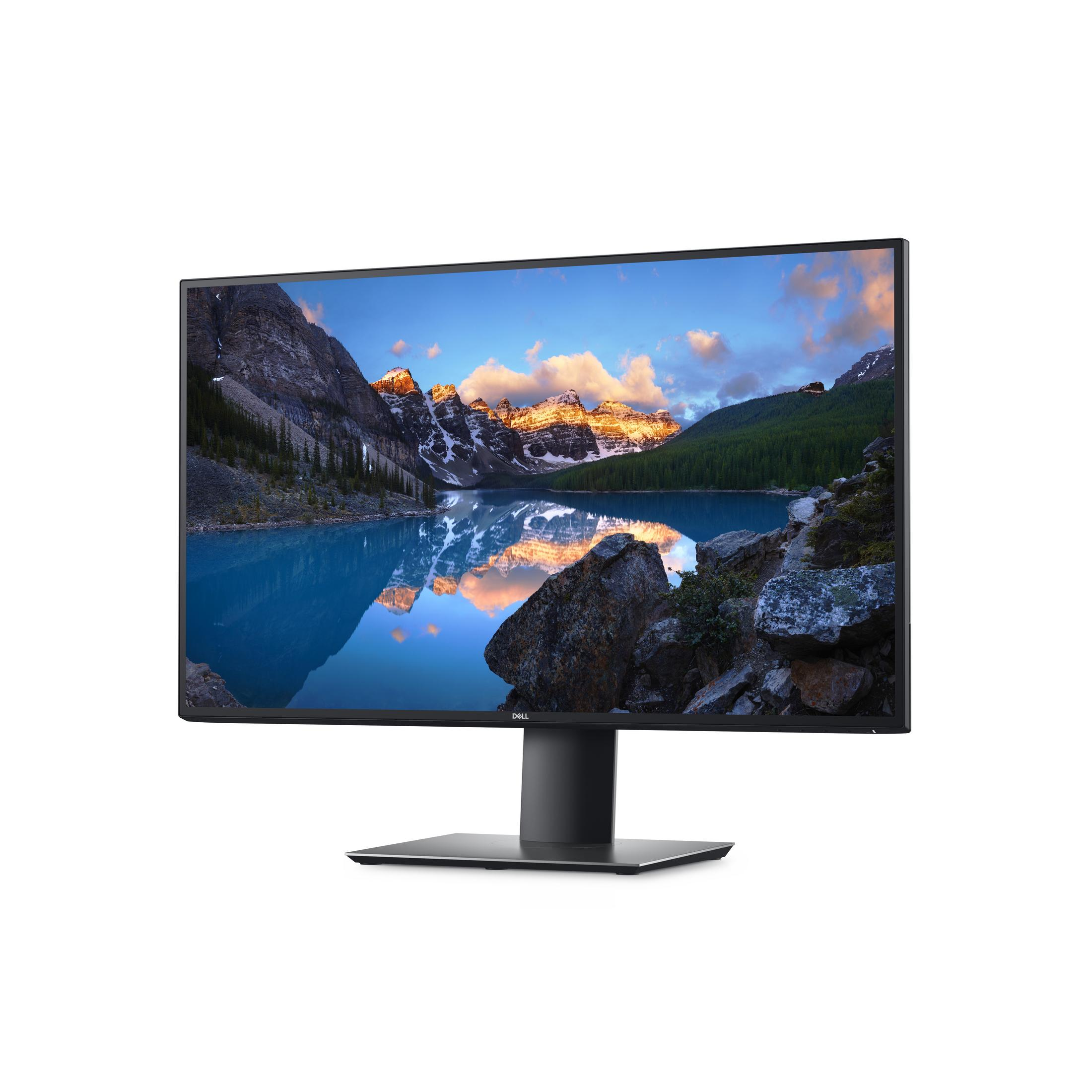 Ein Dell-Monitor, der eine malerische Landschaft mit Bergen und einem See zeigt. Der Bildschirm ist schwarz.