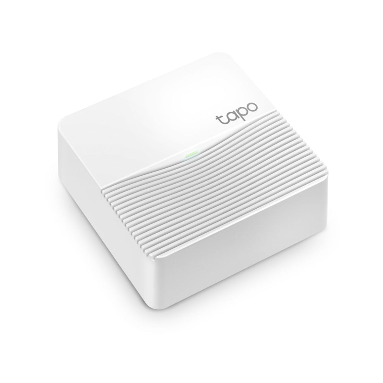 Białe kwadratowe urządzenie Tapo. Ma subtelne zielone światło. Powierzchnia jest karbowana.