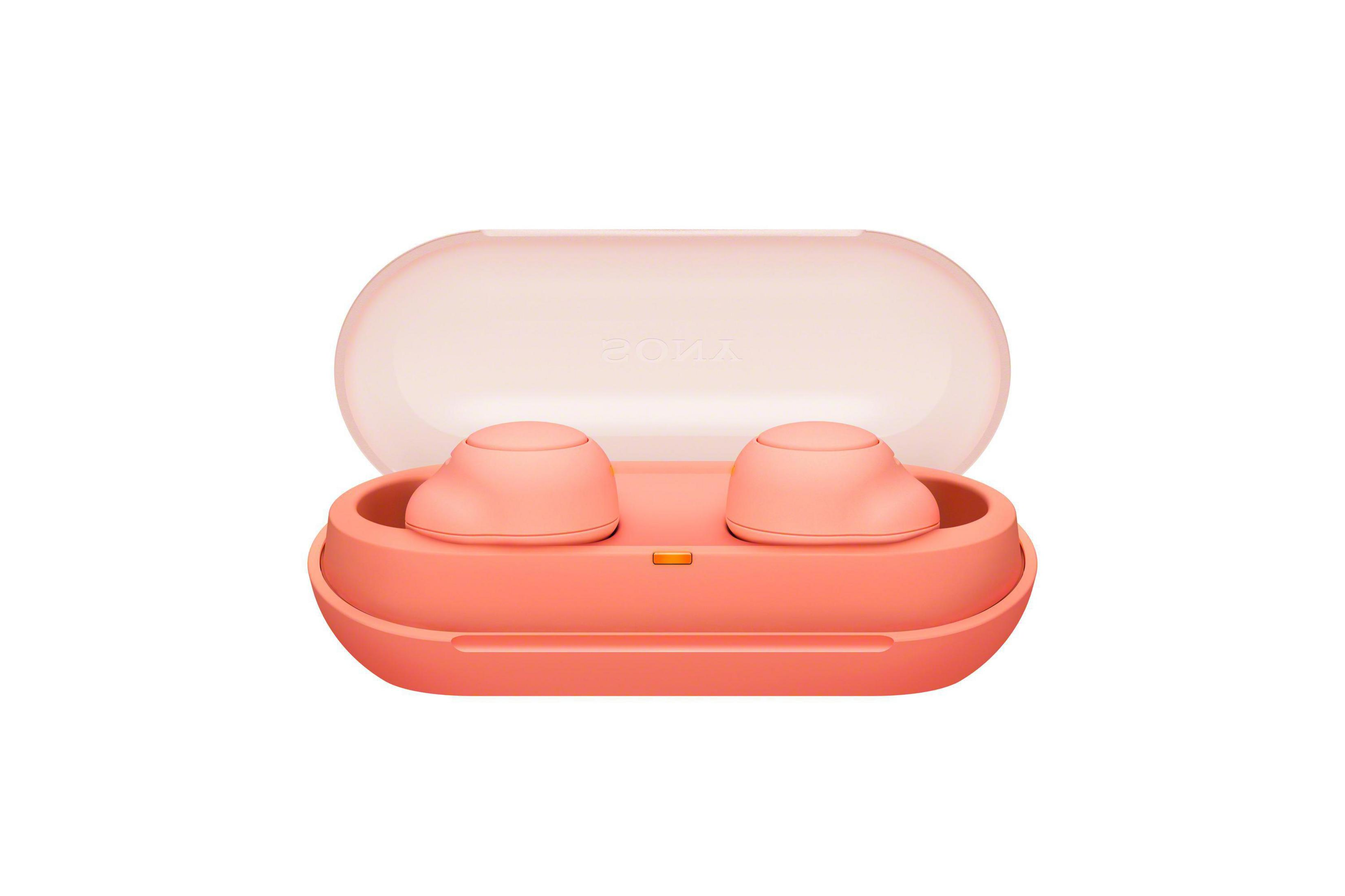 Auriculares inalámbricos rosas en estuche rosa abierto. Sony impreso.