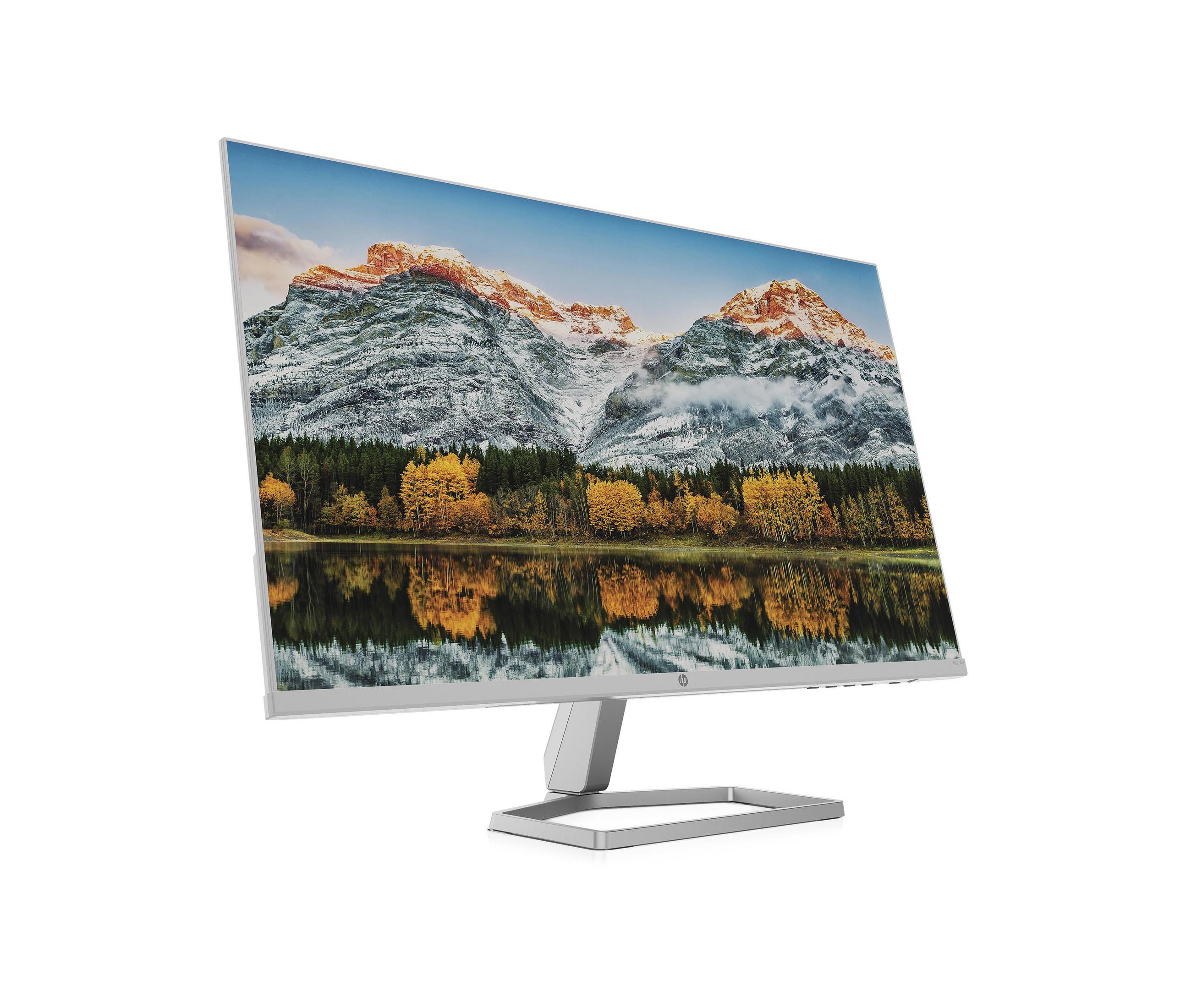 Monitor bianco che mostra un paesaggio di montagne e un lago. Sfondo bianco.