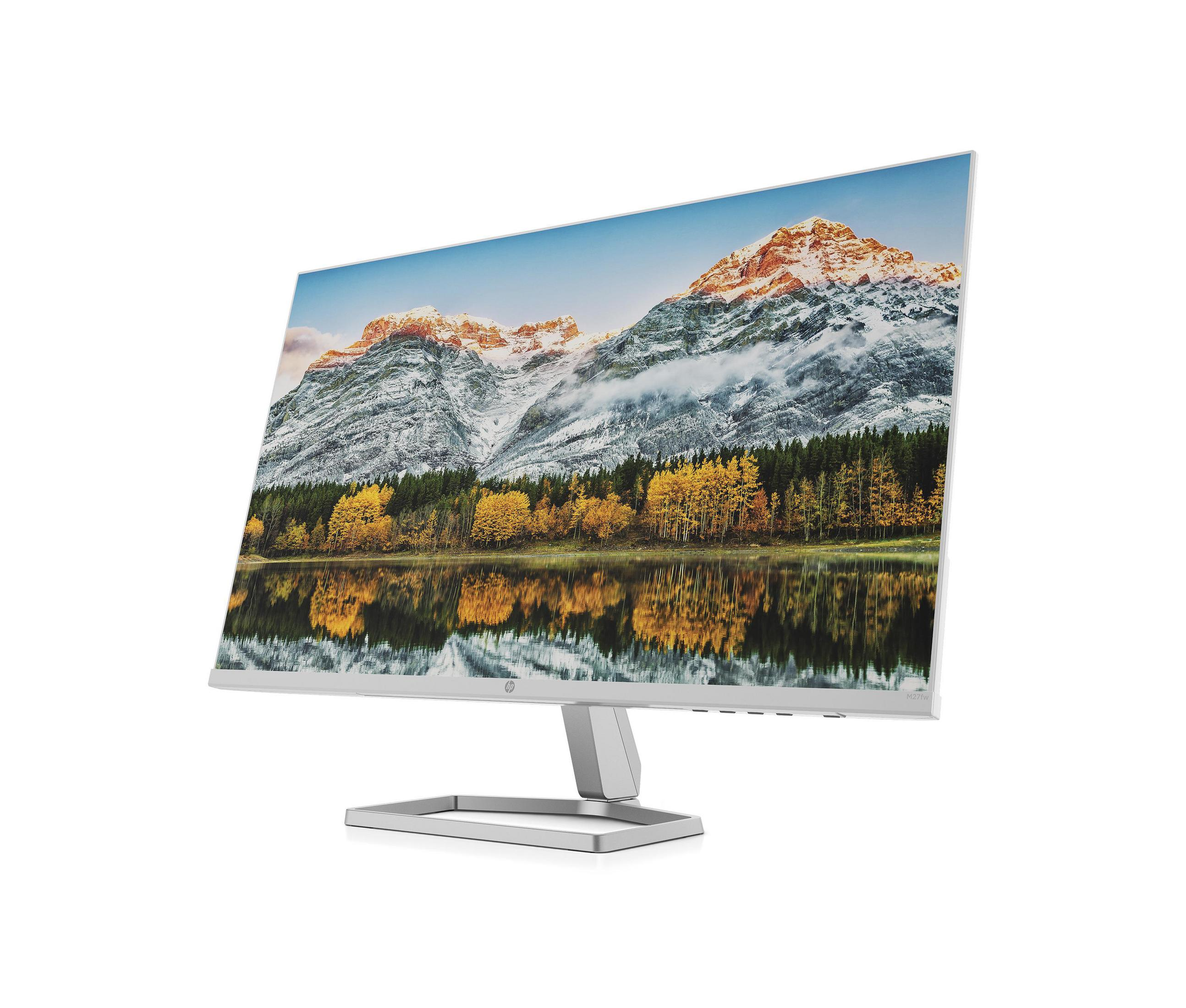 Un monitor del computer che mostra un paesaggio montano innevato. Ha un supporto e una cornice argentati. Sfondo bianco.