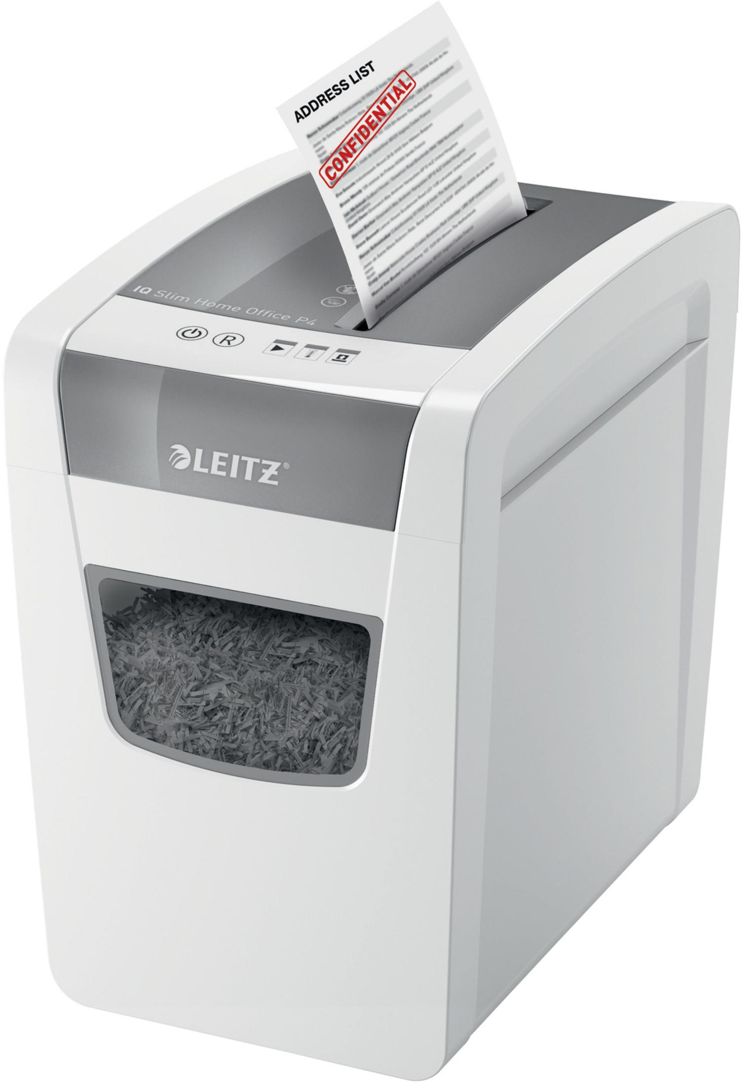 Biała niszczarka do papieru. Papier ze słowem "POUFNE" jest wkładany do niszczarki.