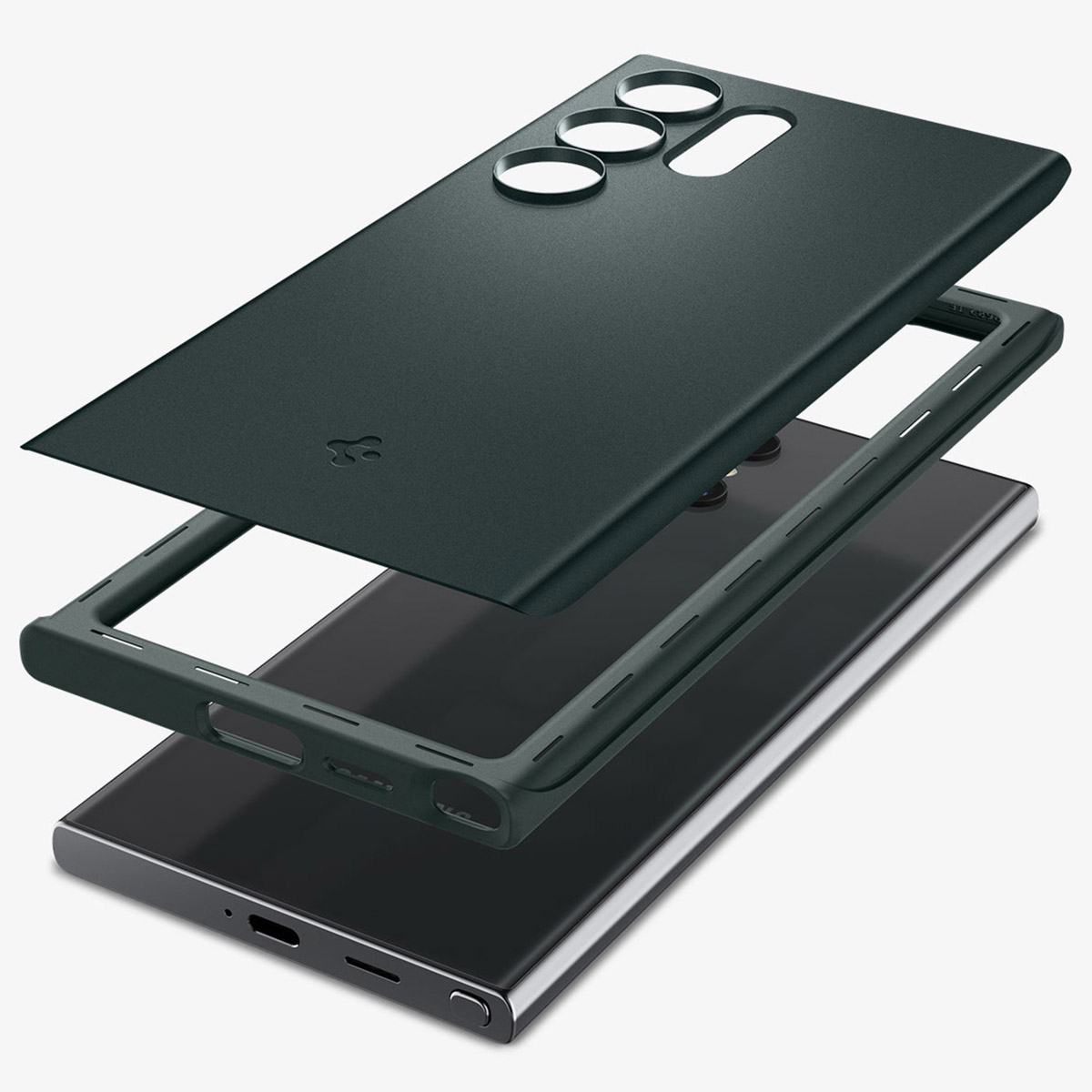 Een telefoonhoesje in lagen. Donkergroene cover, donkergrijs frame en een zwarte telefoon.