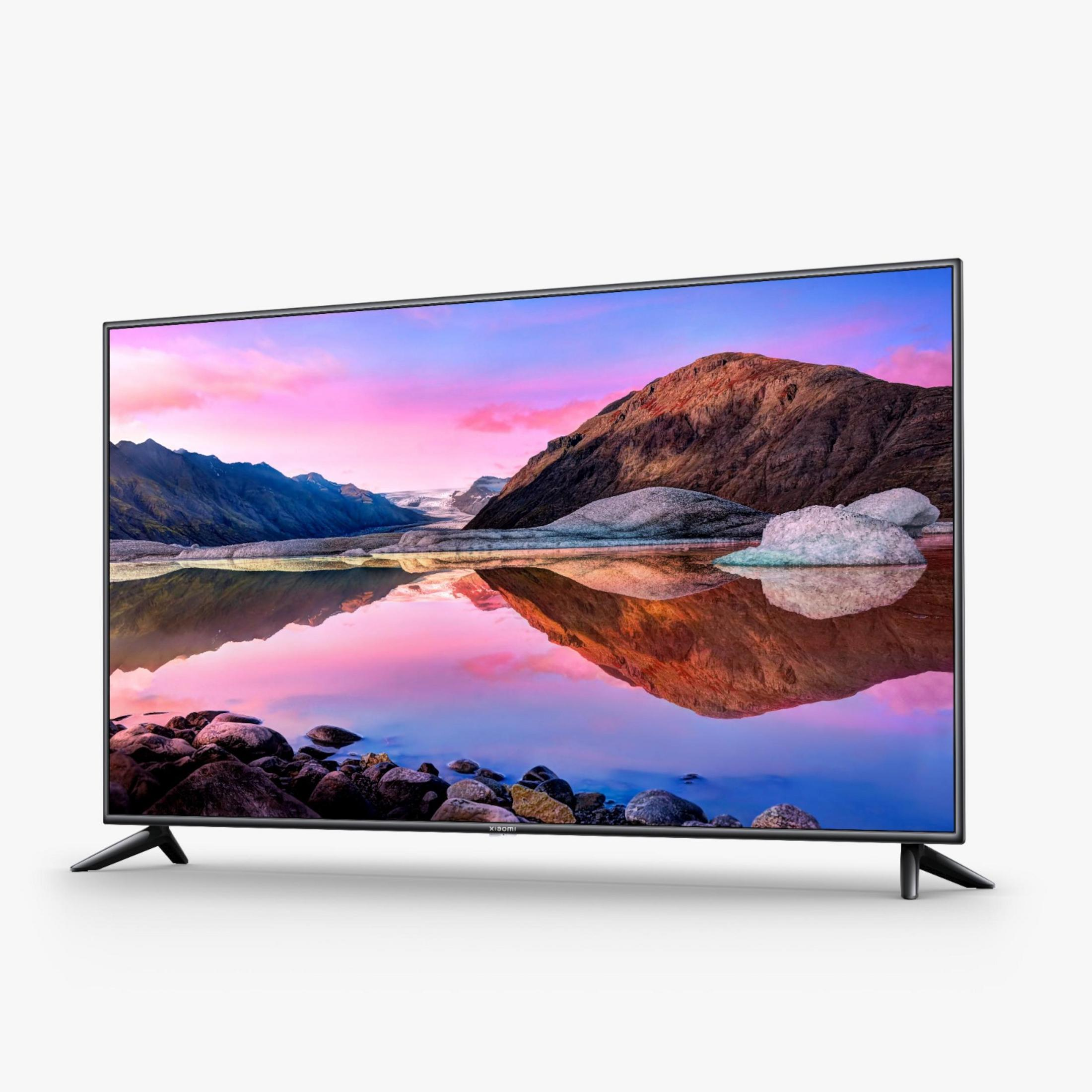 Breedbeeld-tv met landschap en roze lucht.