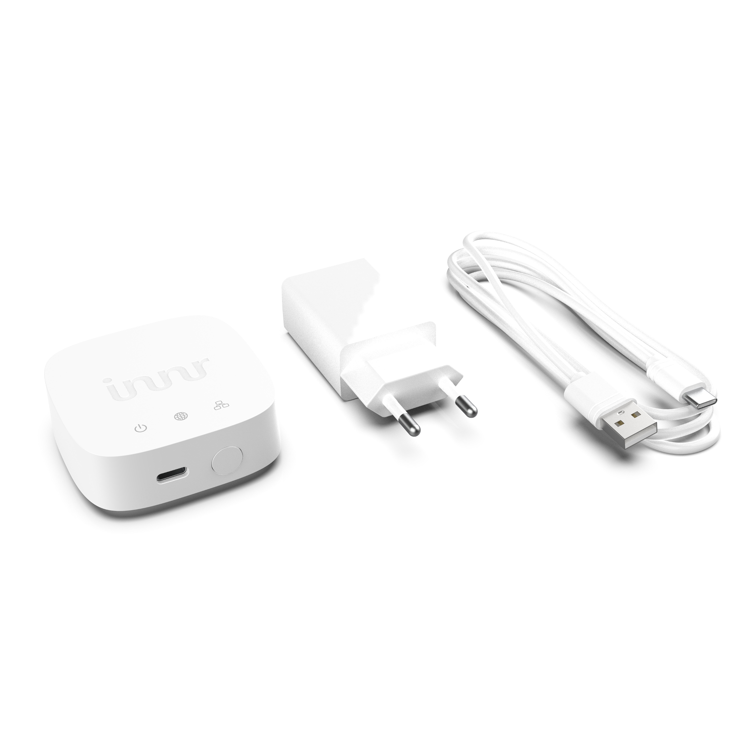 Weißes elektronisches Gerät mit drei Komponenten: eine Box, ein Ladegerät und ein USB-Kabel.
