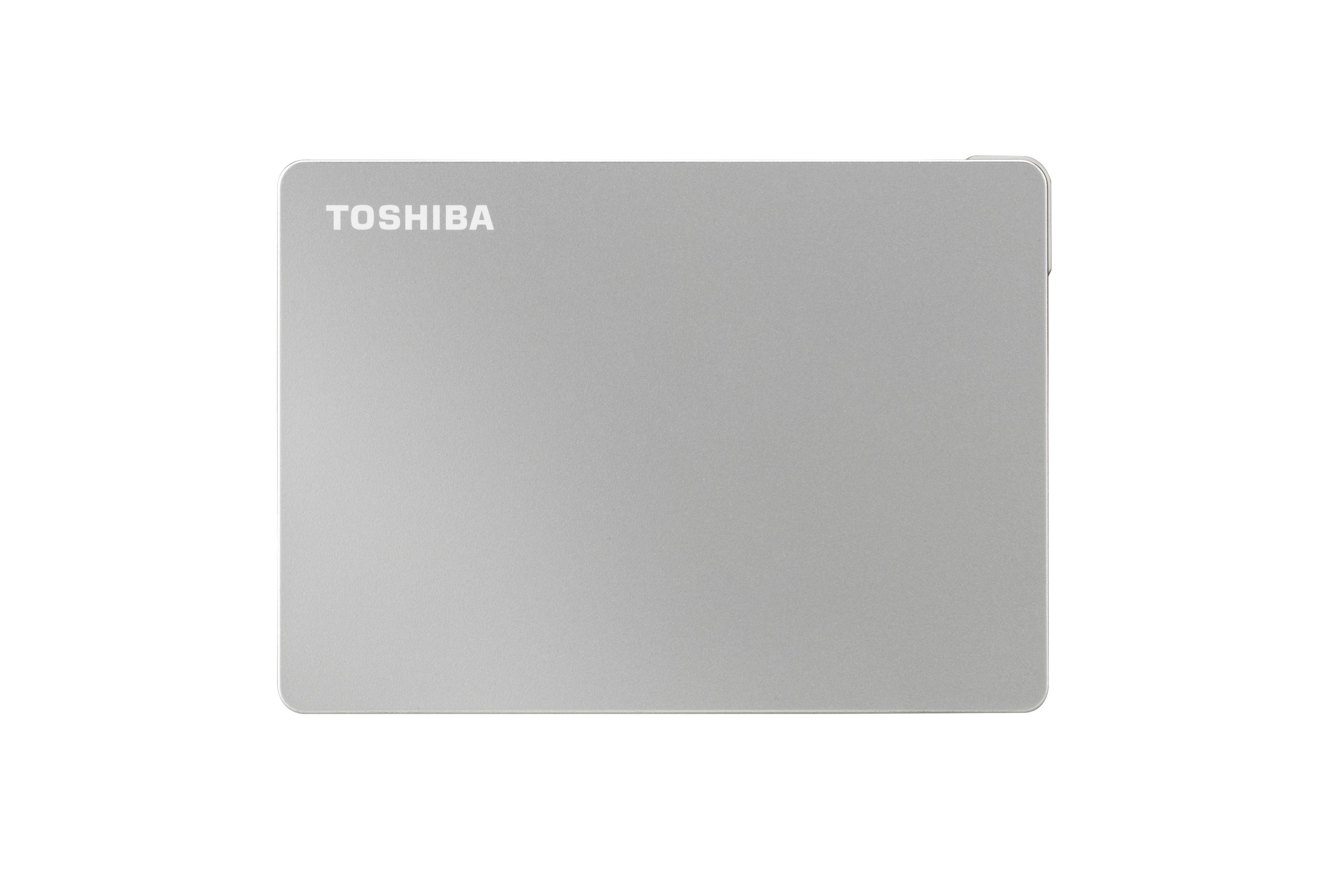 Srebrny zewnętrzny dysk twardy Toshiba. Nazwa marki jest wydrukowana na górze.