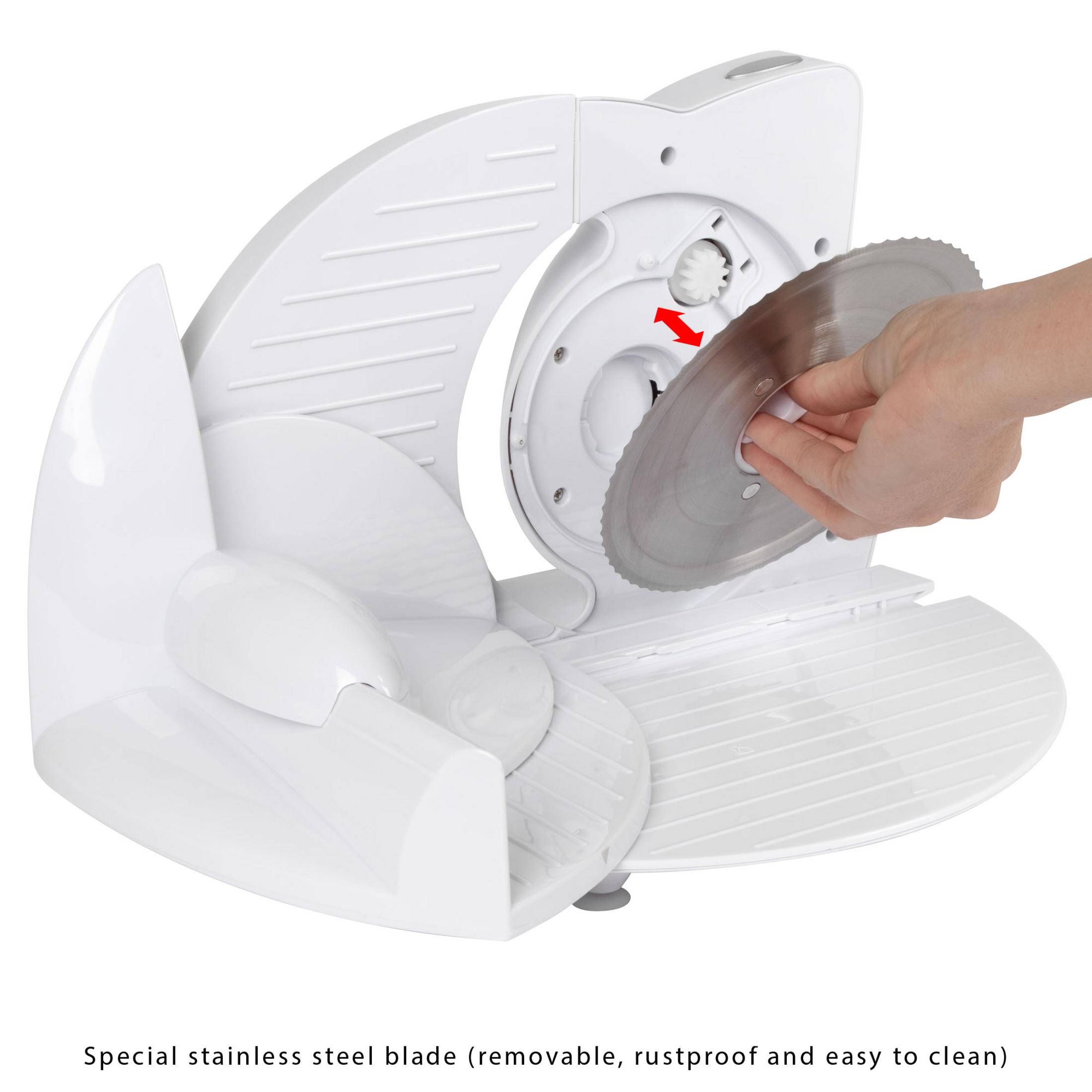 Biała krajalnica do żywności, dłoń wymienia ostrze.