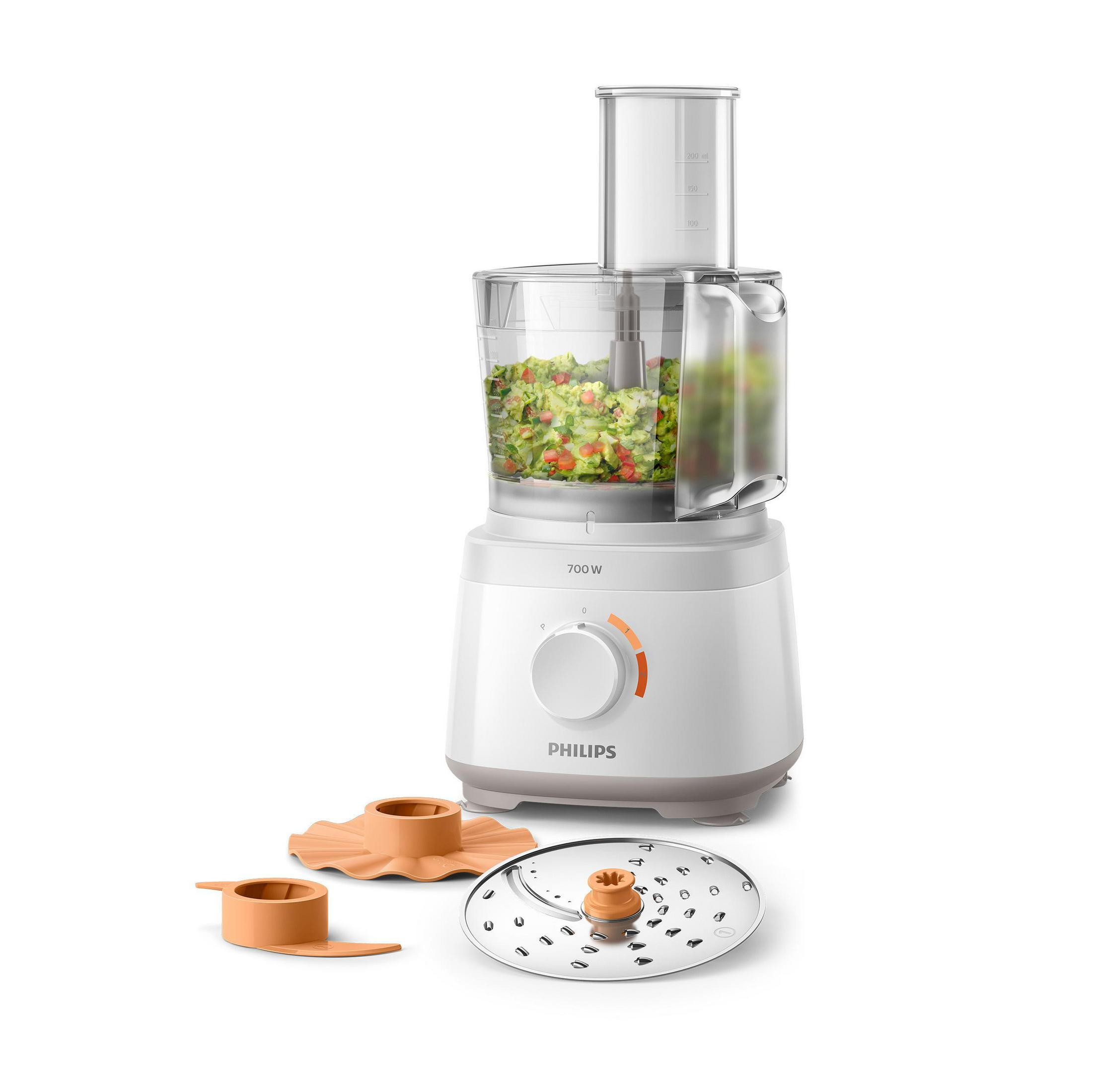 White food processor with accessories. It has a container filled with chopped vegetables inside.