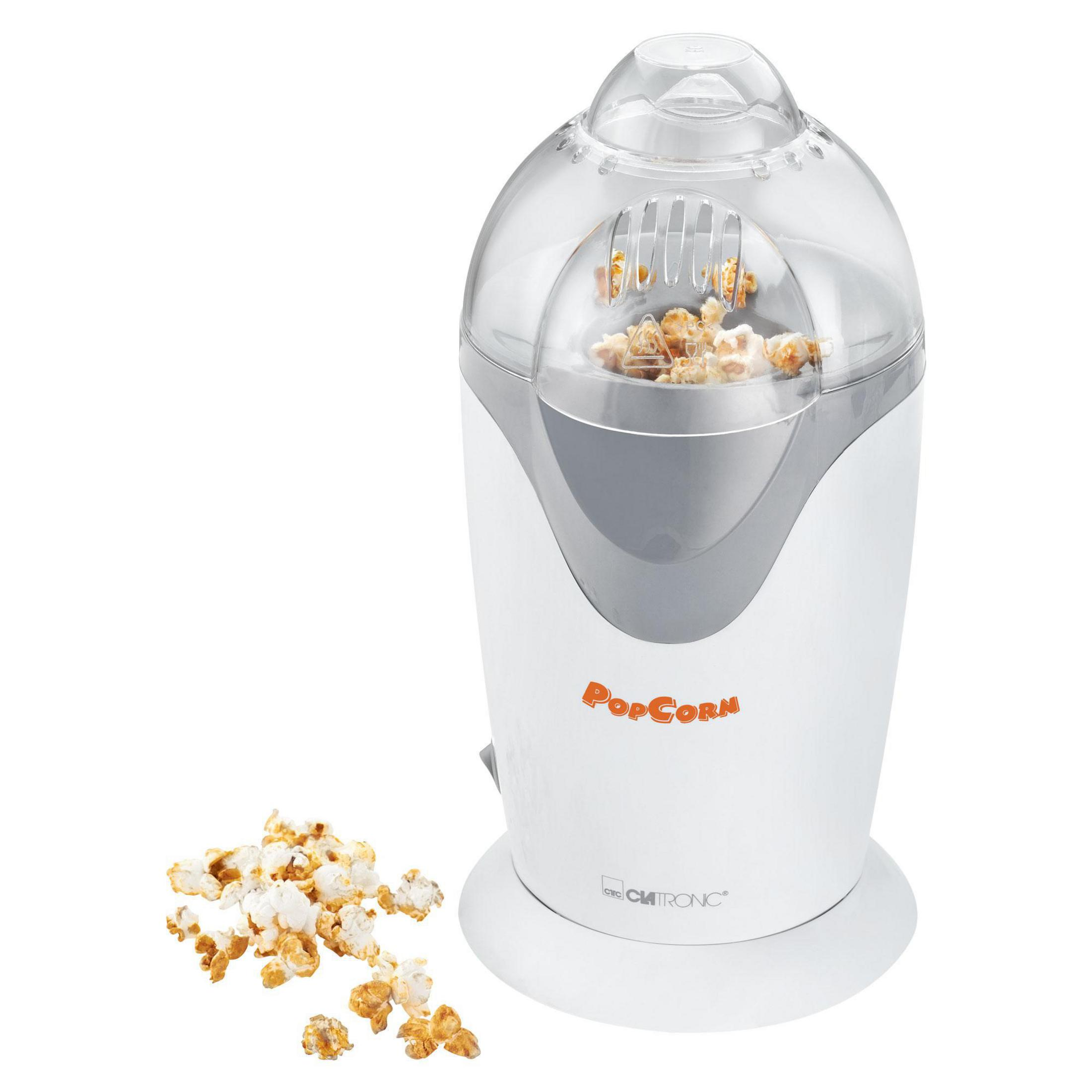 Eine weiß-graue Popcornmaschine mit Popcorn und einem durchsichtigen Deckel. Das Popcorn ist hellgelb.