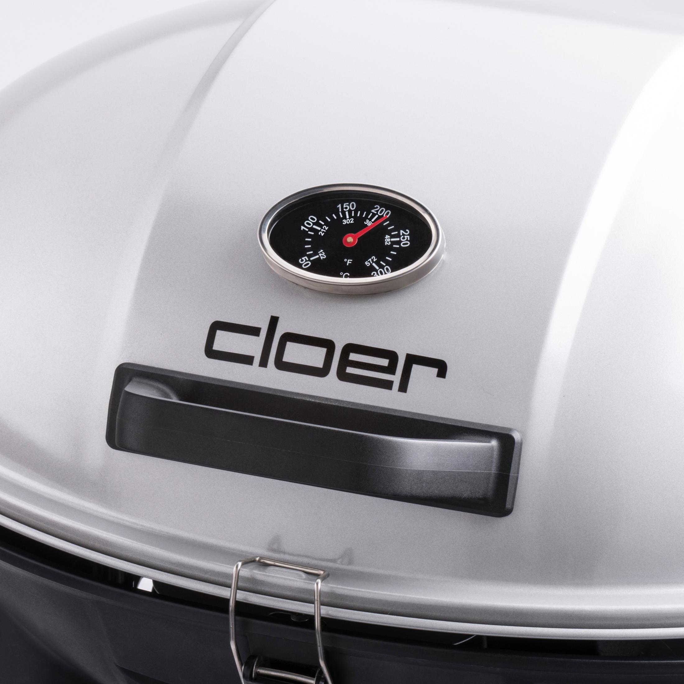 Nahaufnahme eines silbernen Grilldeckels mit Thermometer und dem Wort 'cloer'.