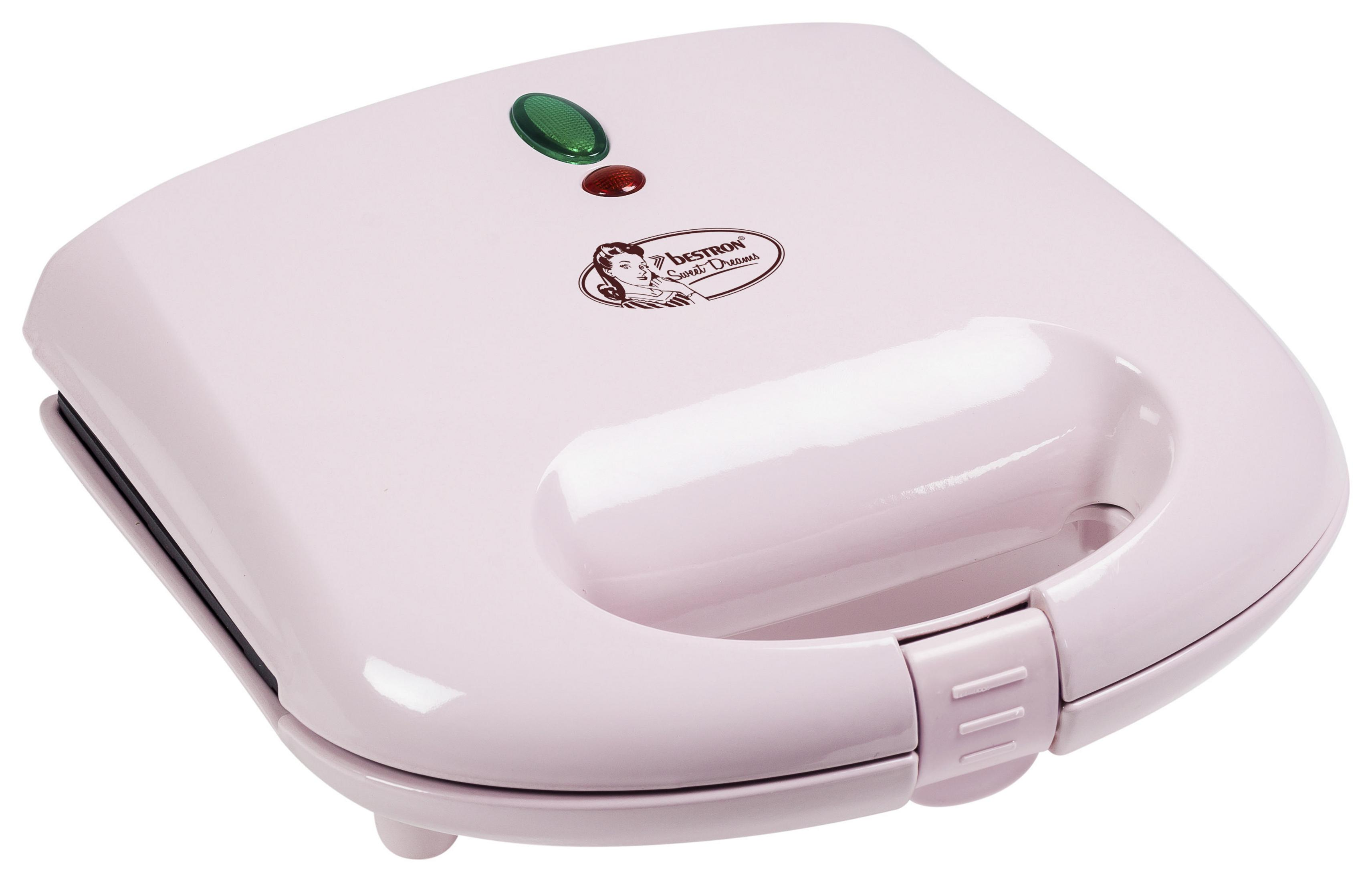 Różowa opiekacz do kanapek z uchwytem i małą czerwoną i zieloną lampką na górze.