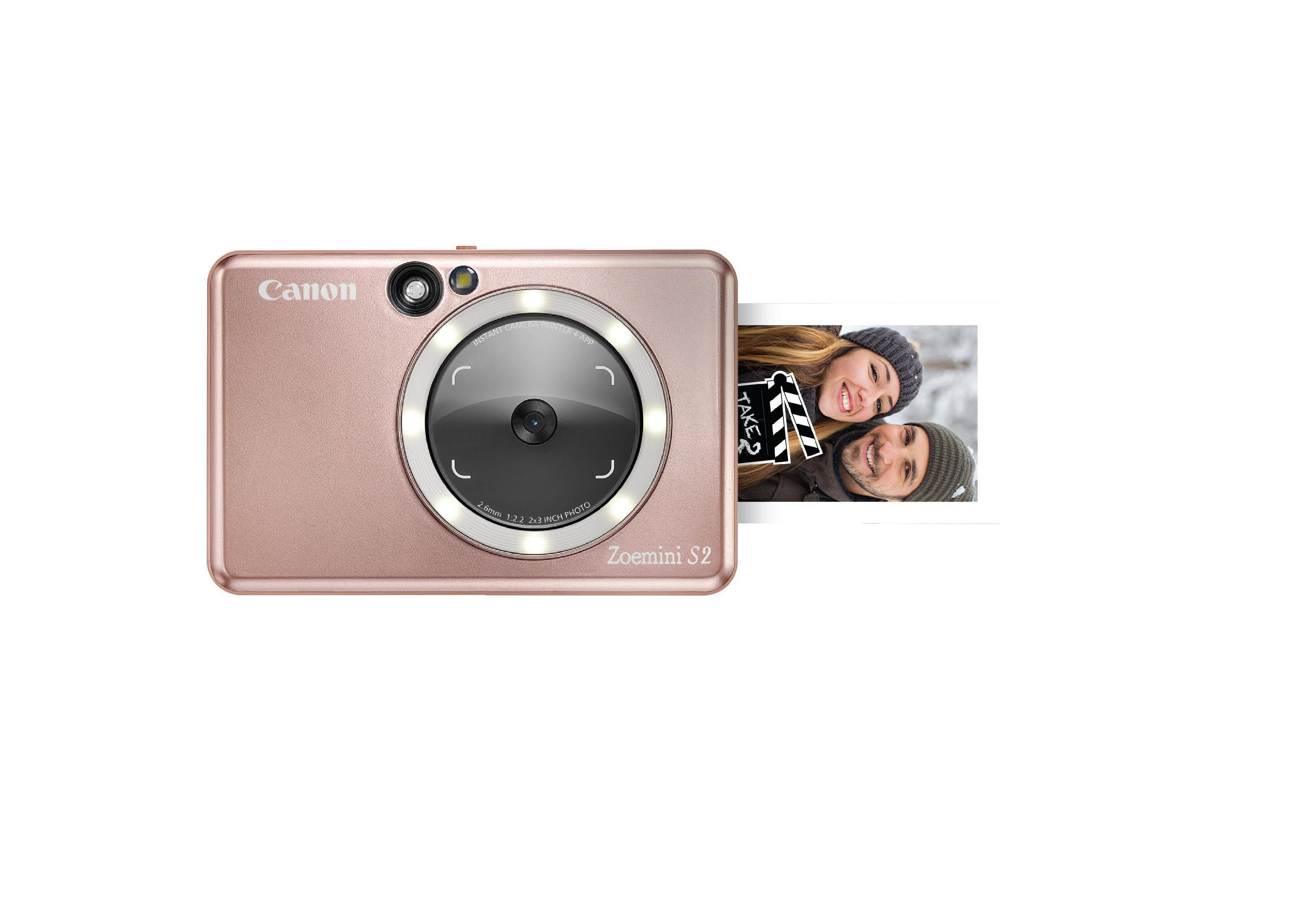 Een roze Canon Zoemini S2 camera met een afdruk van een stel.