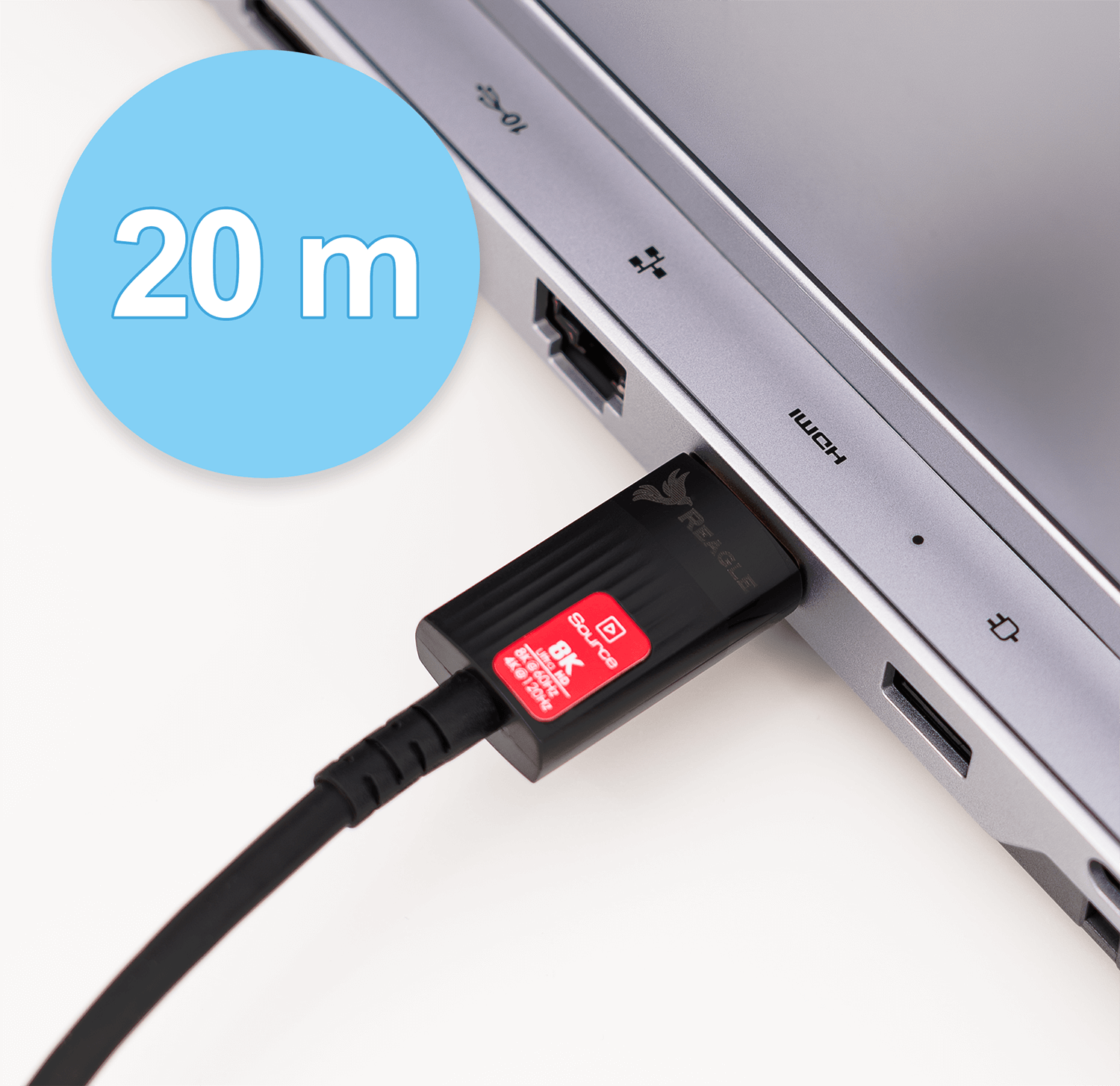 Czarny kabel podłączony do laptopa, z niebieskim okręgiem wskazującym 20 metrów.