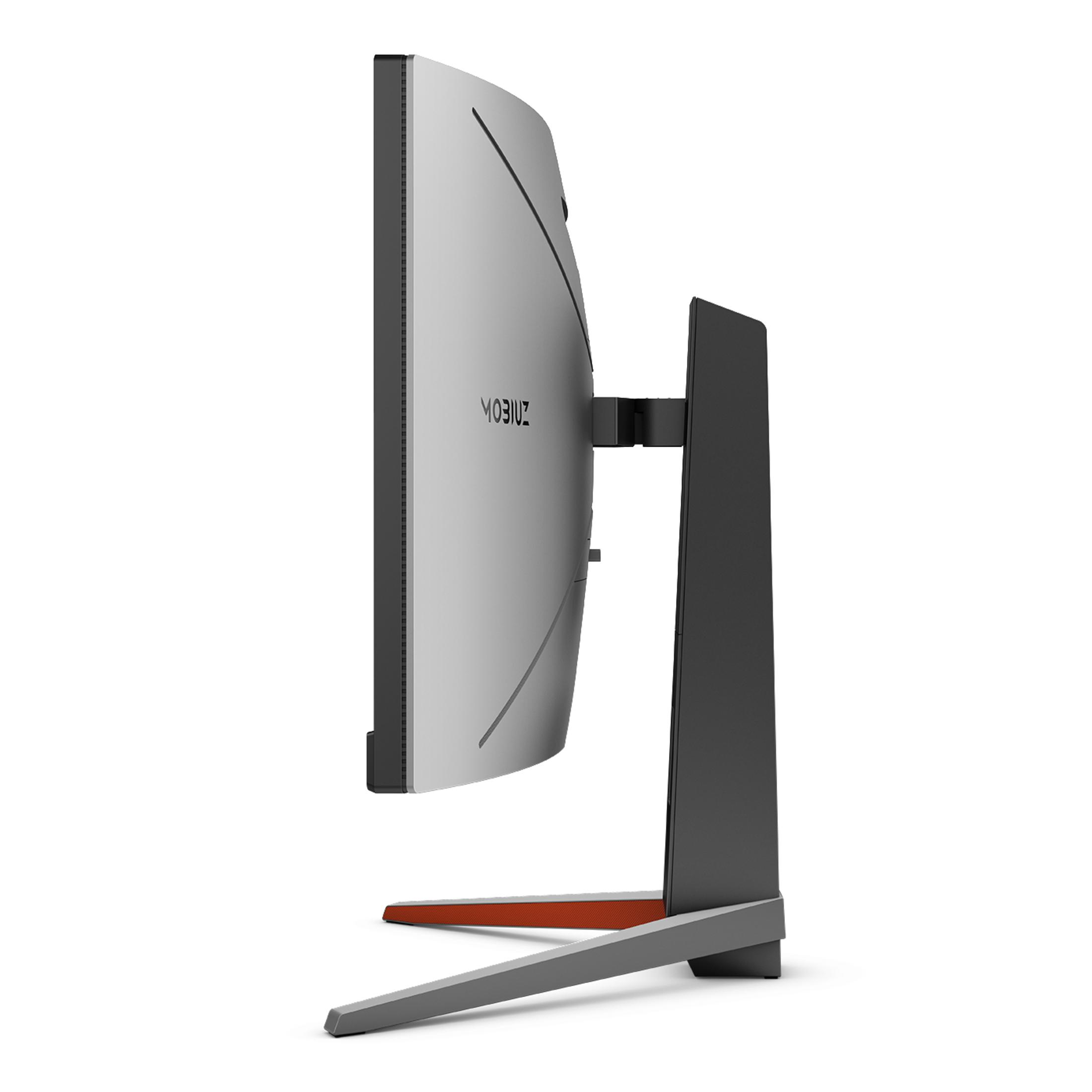 Widok z boku zakrzywionego monitora komputera z szarą podstawą i pomarańczową podstawą.