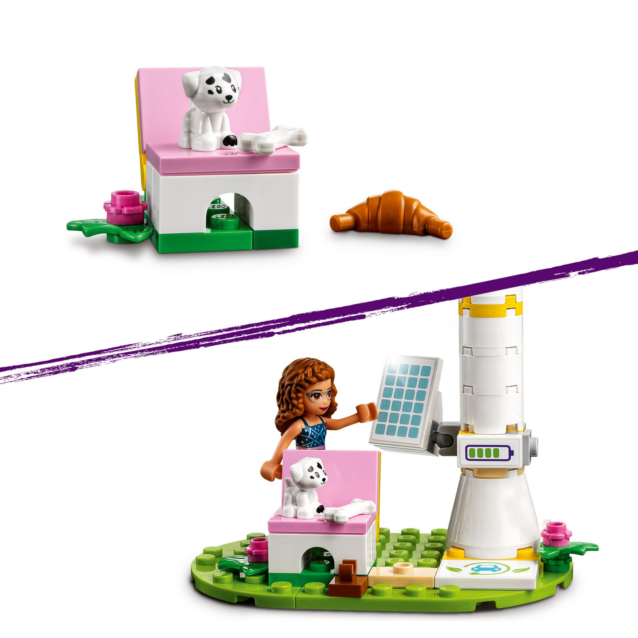 LEGO-Set mit einem Mädchen und einem Hund. Ein Hund sitzt auf einem Stuhl, es gibt ein Croissant und ein Solarpanel.