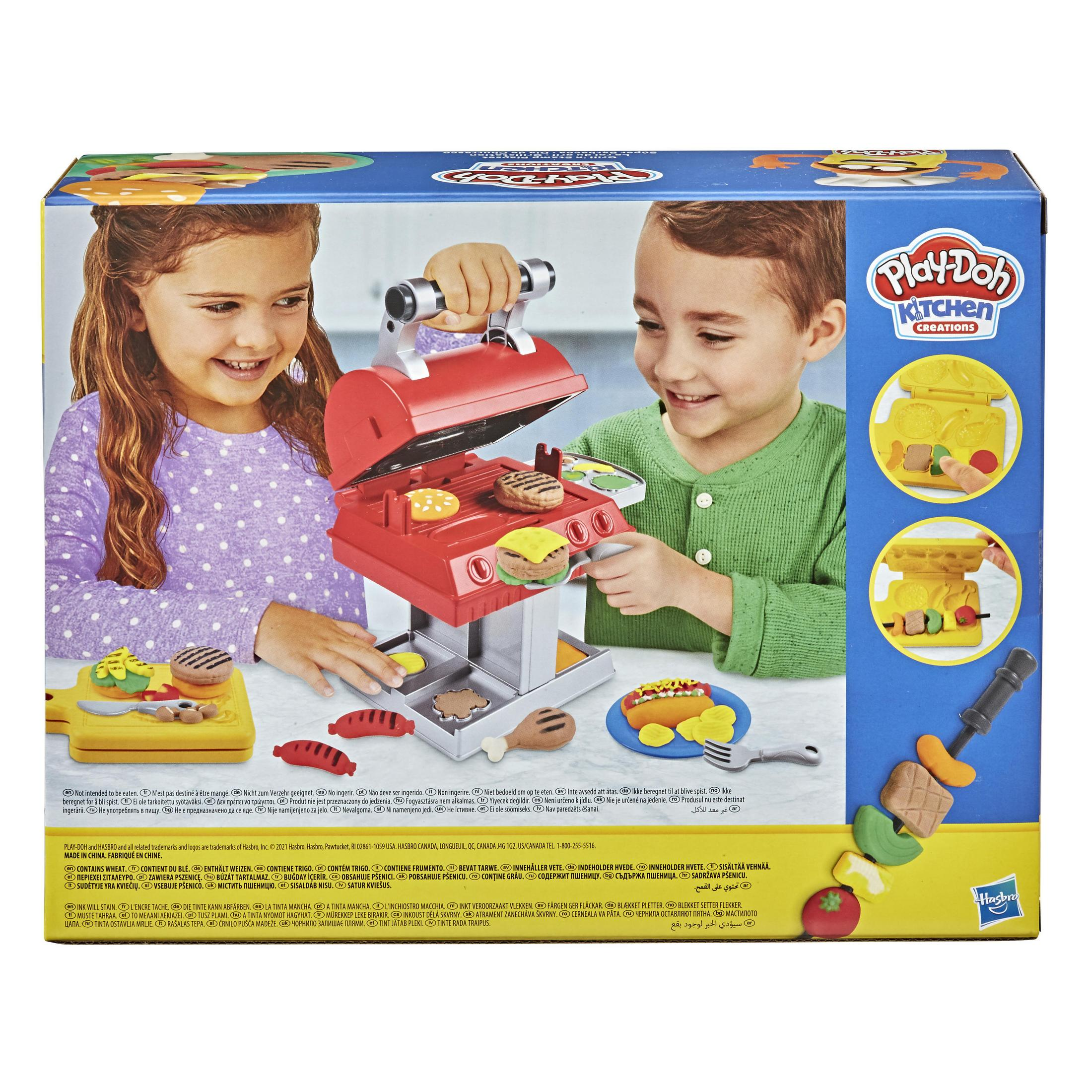 Parte trasera de una caja de parrilla Play-Doh de juguete con niños jugando.