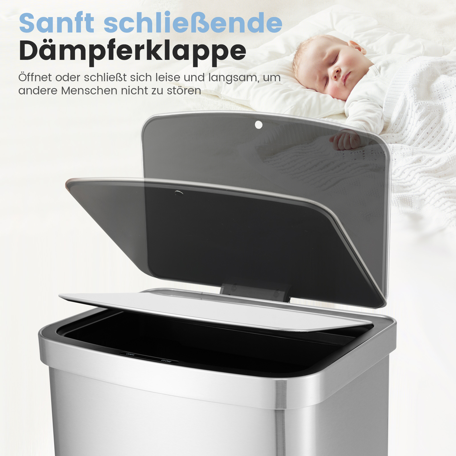Silberner Mülleimer mit schlafendem Baby im Hintergrund.