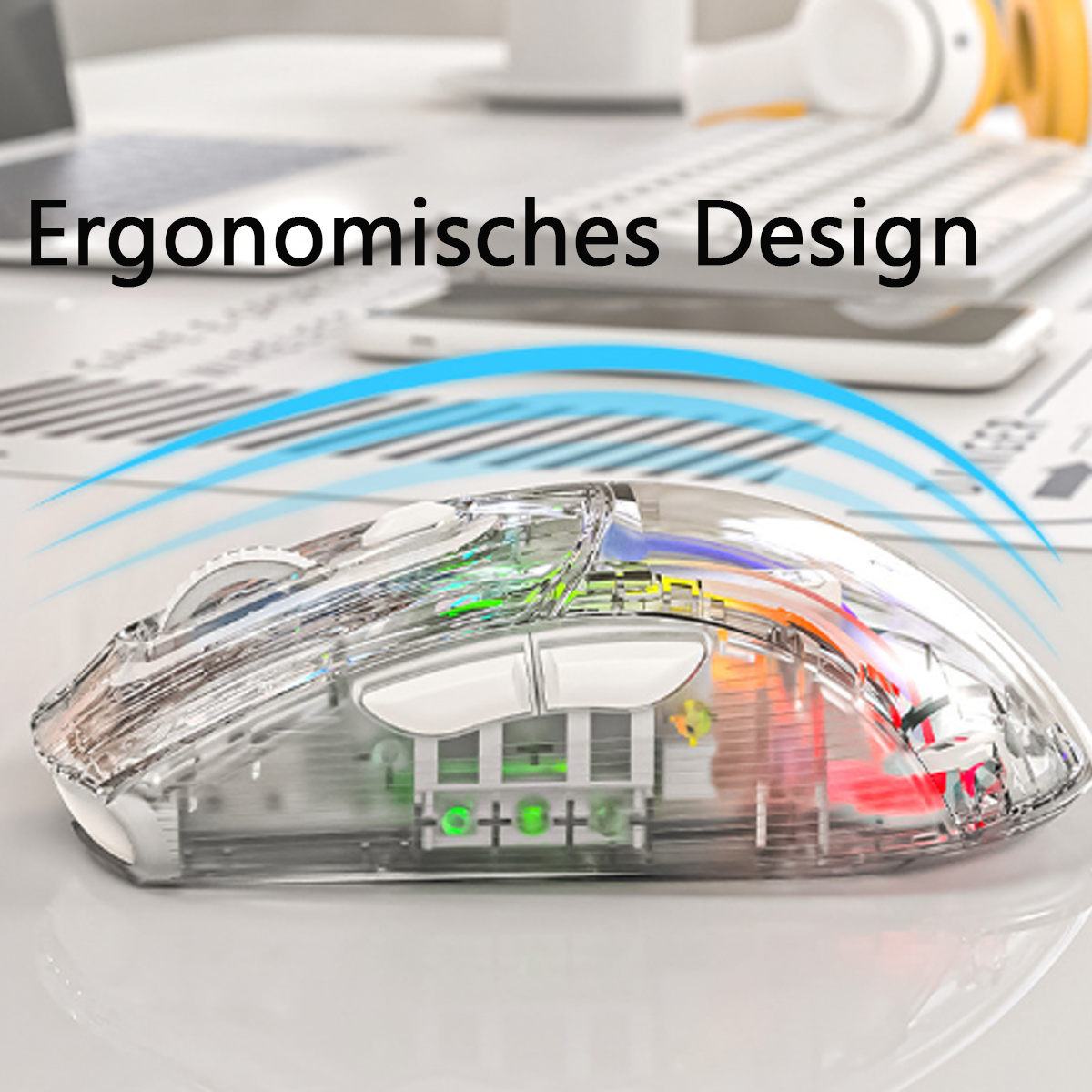 Transparente Maus, die ihre inneren Komponenten zeigt. Tastatur und Telefon im Hintergrund.