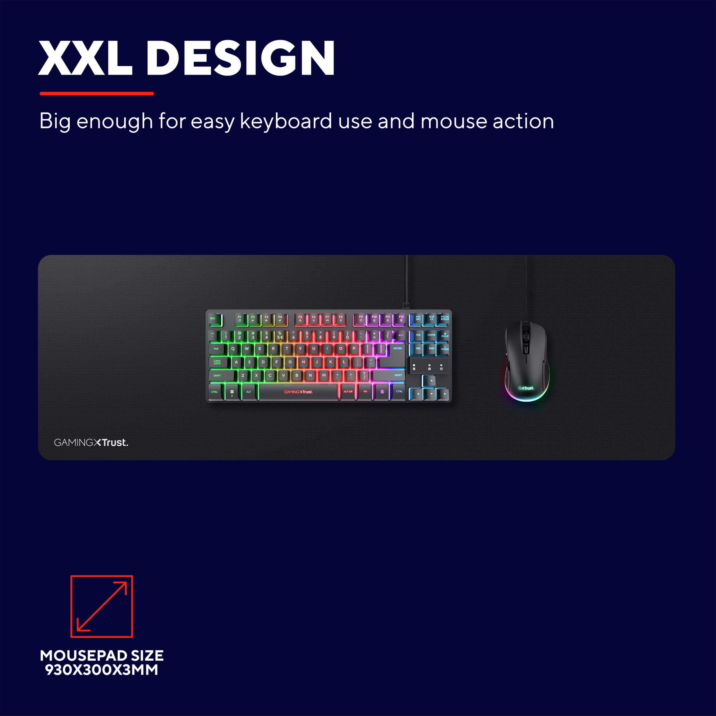 Tapis de souris XXL noir. Clavier et souris dessus. Lumières rouges, vertes et bleues.