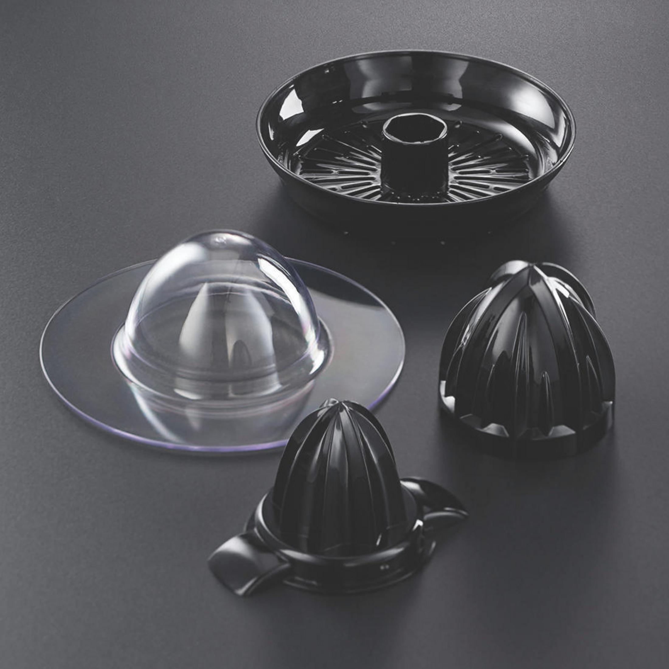 Componenti dell'estrattore di succo, tra cui un contenitore nero, un coperchio trasparente e coni.