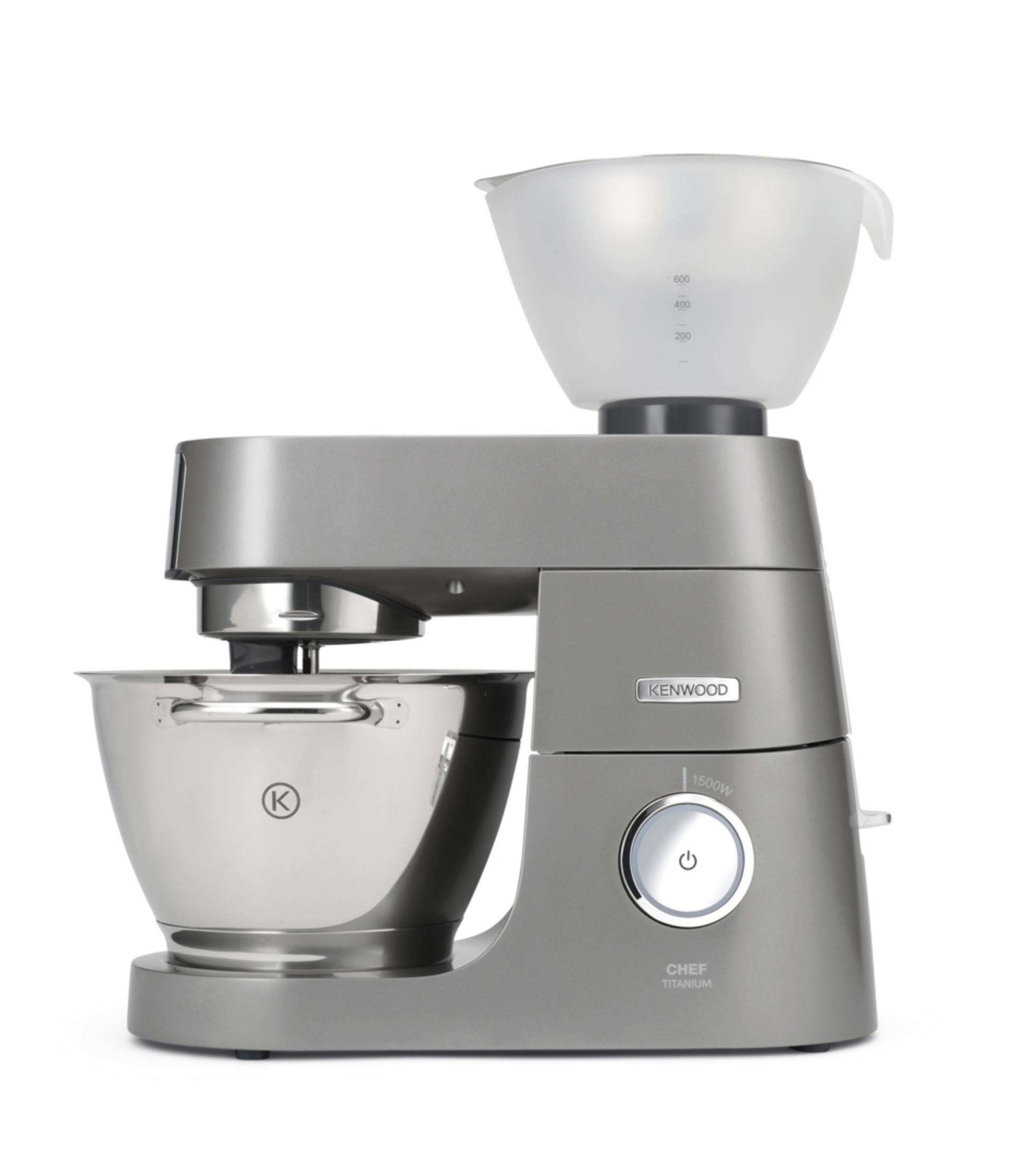 Szary robot kuchenny Kenwood. Ma misę, nakładkę do mieszania i przezroczystą plastikową pokrywę.
