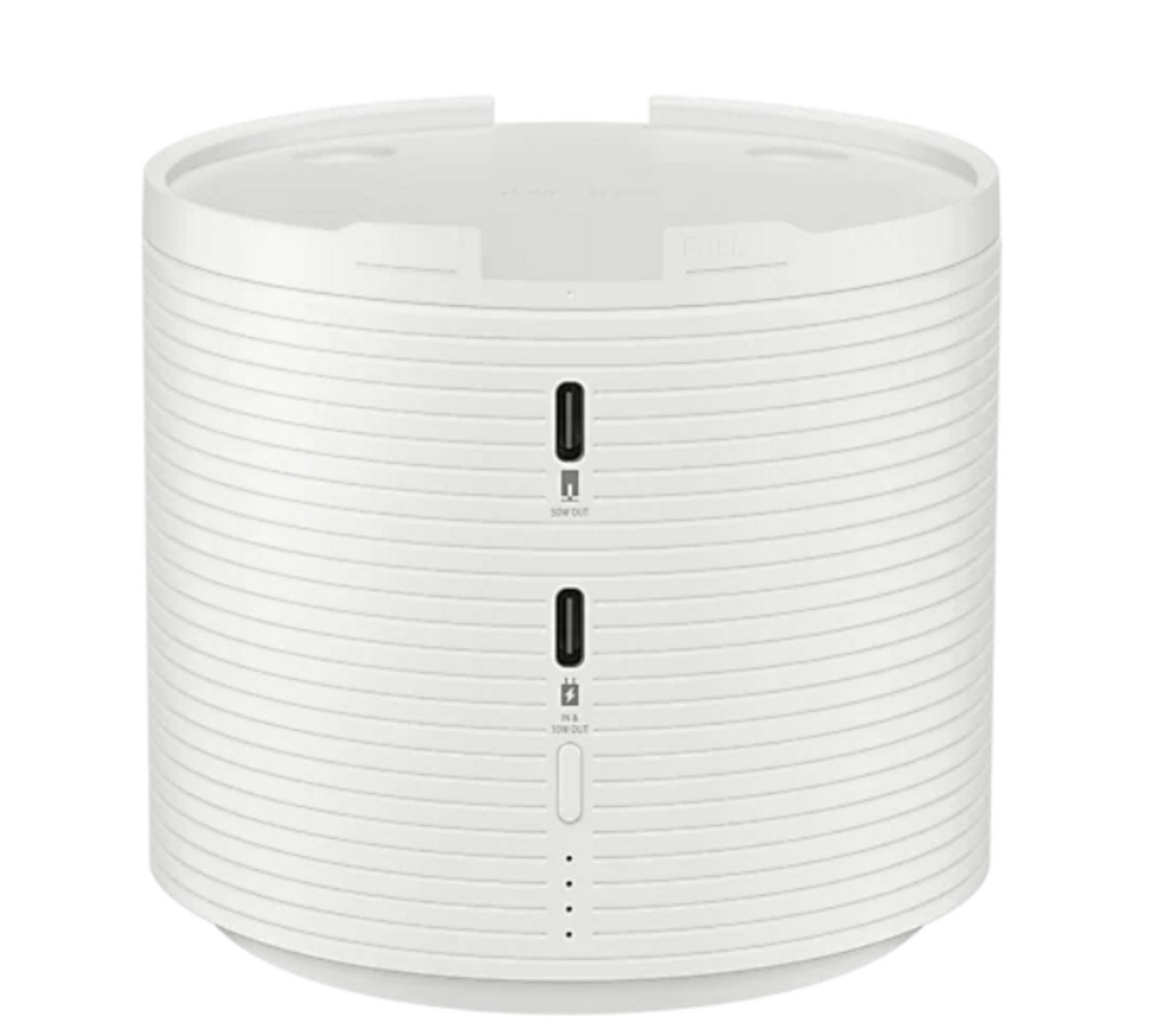 Un altavoz inteligente cilíndrico blanco con puertos USB y una serie de luces indicadoras.
