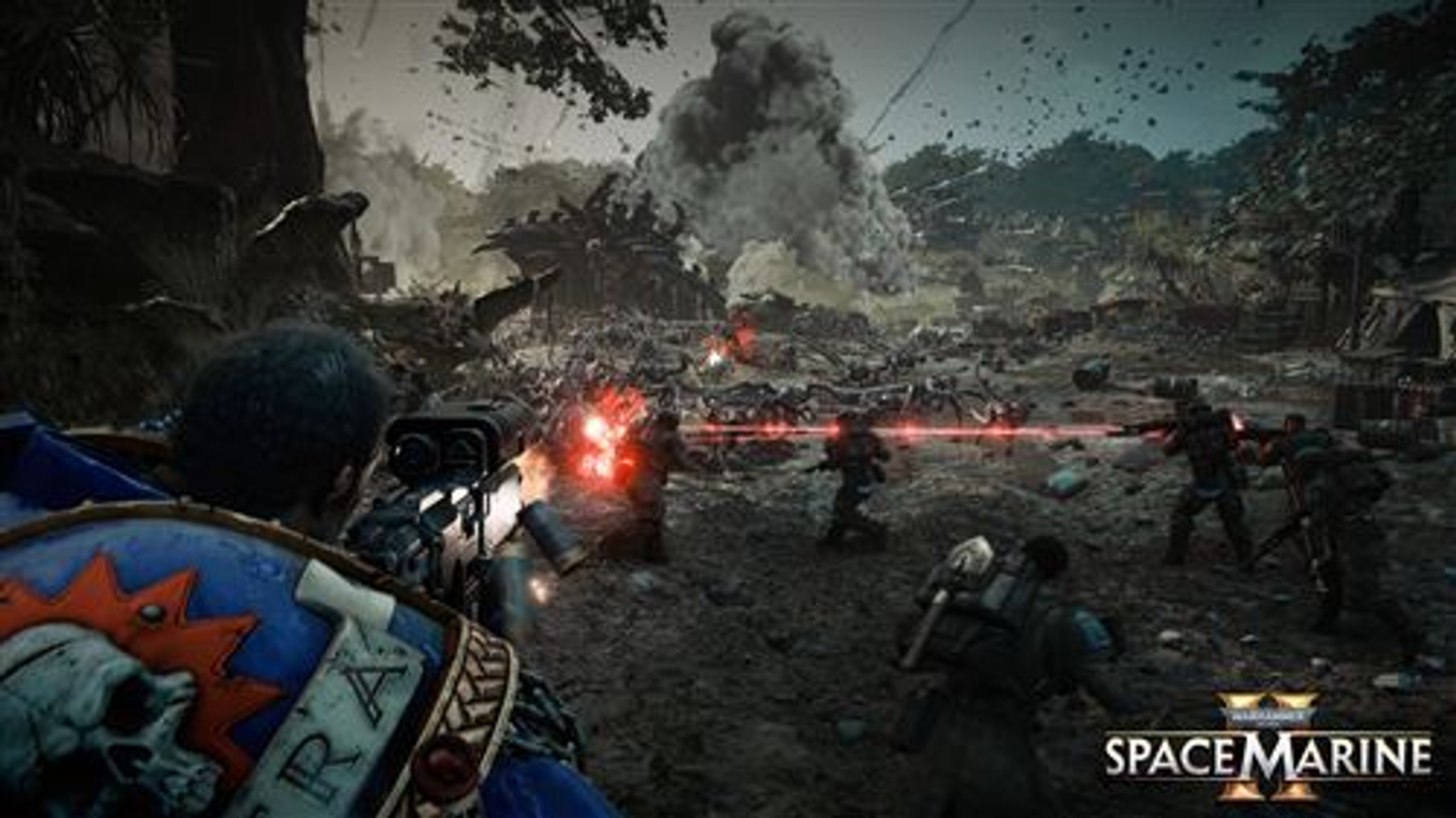 Escena del juego Warhammer 40,000: Space Marine. Soldados disparando en una zona de guerra.