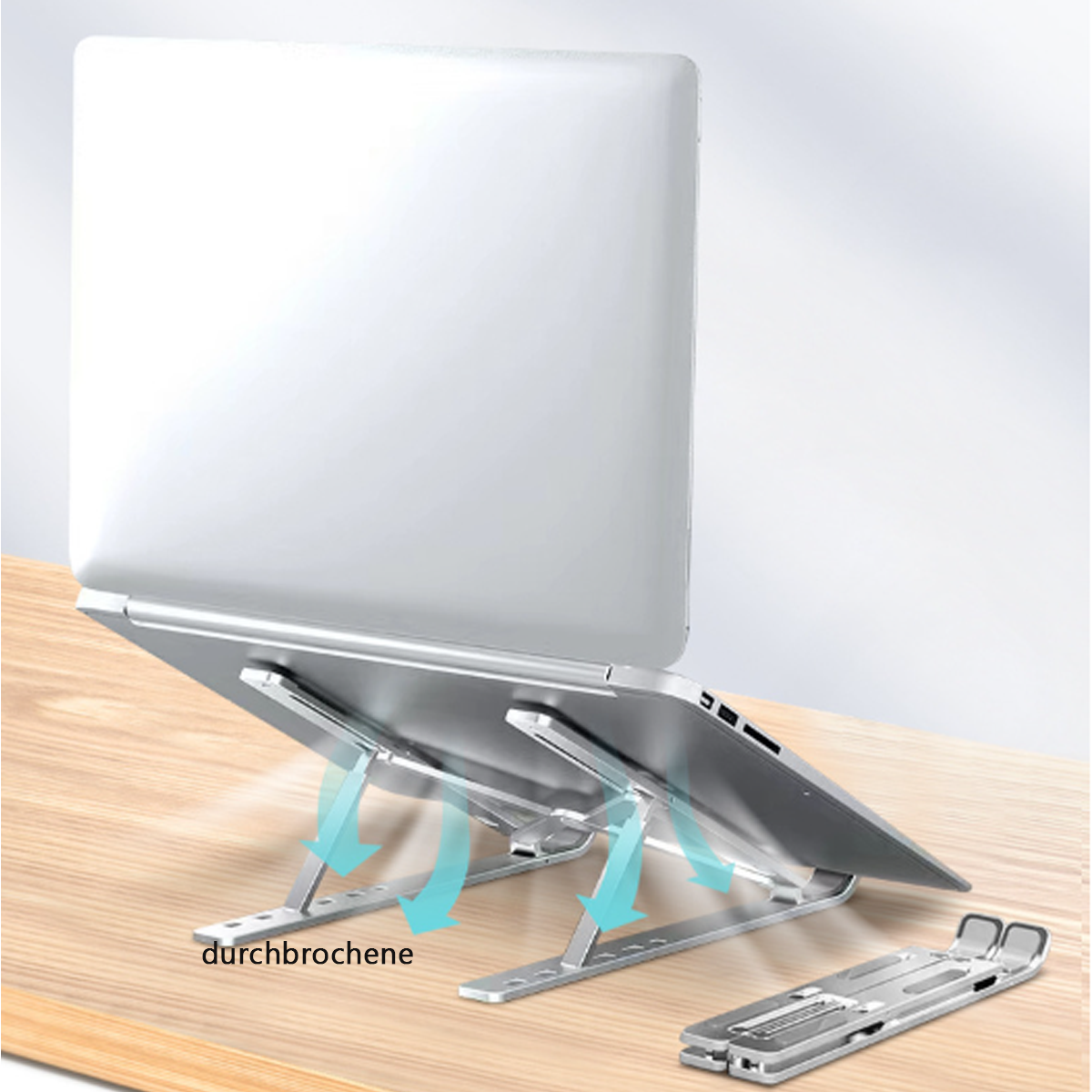 Silberner Laptopständer mit einem Laptop darauf. Pfeile zeigen den Luftstrom.