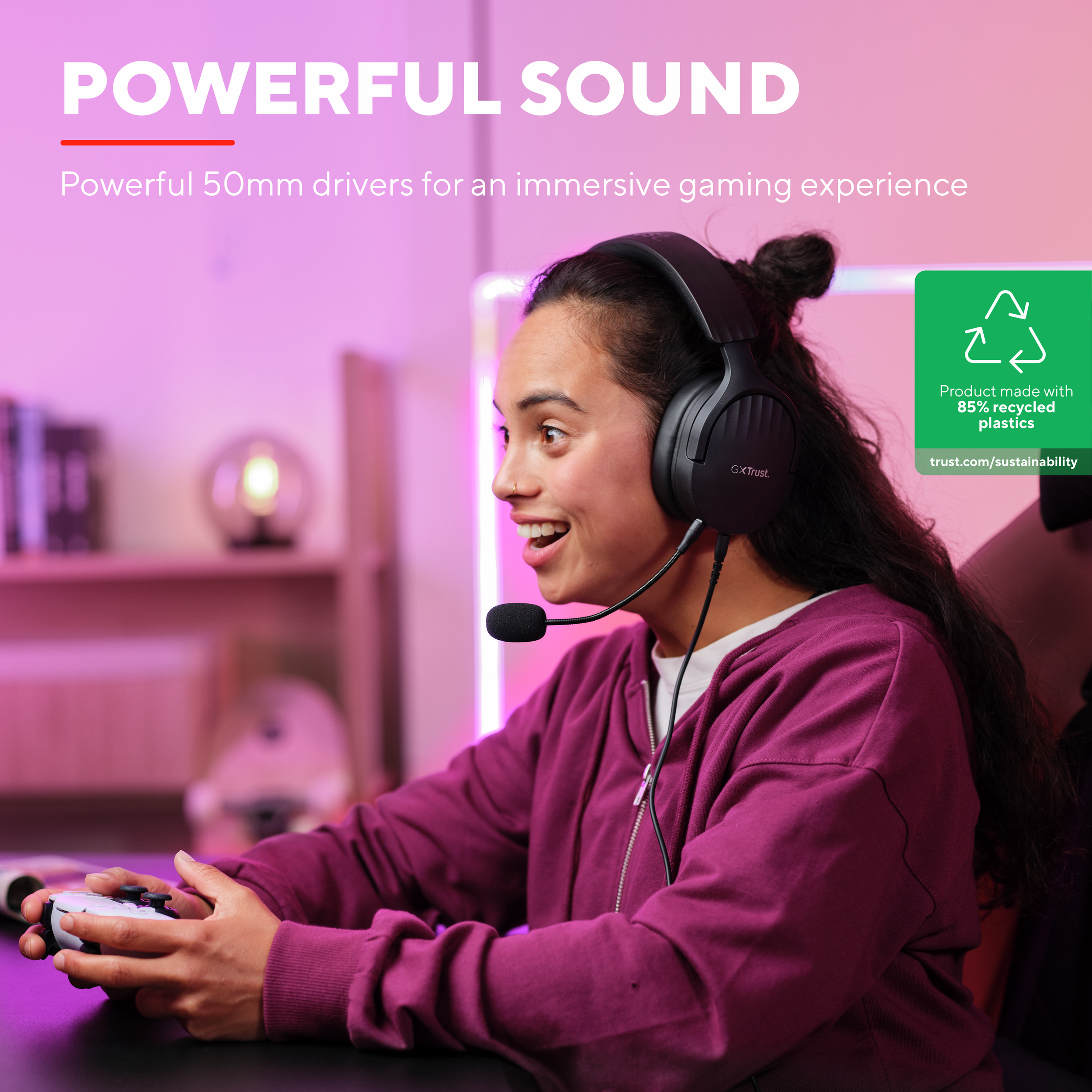 Woman gaming with headset and controller, smiling. Text says powerful sound and recycled.